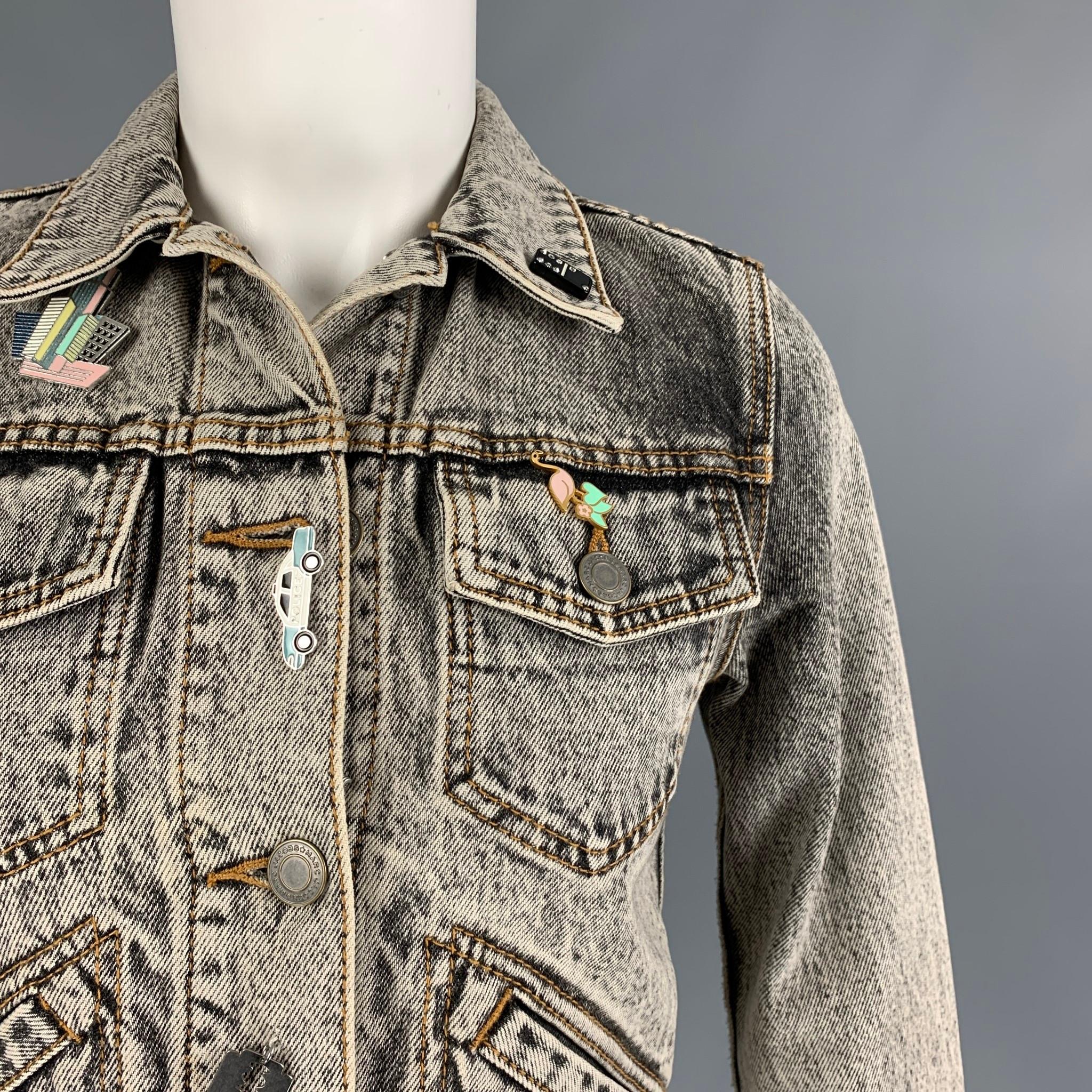 MARC JACOBS jacket comes in a black acid-wash denim featuring a cropped style, pin details, patches throughout, contrast stitching, front pockets, a back embroidered 'paradise' design, and a buttoned closure. 

Very Good Pre-Owned Condition.
Marked: