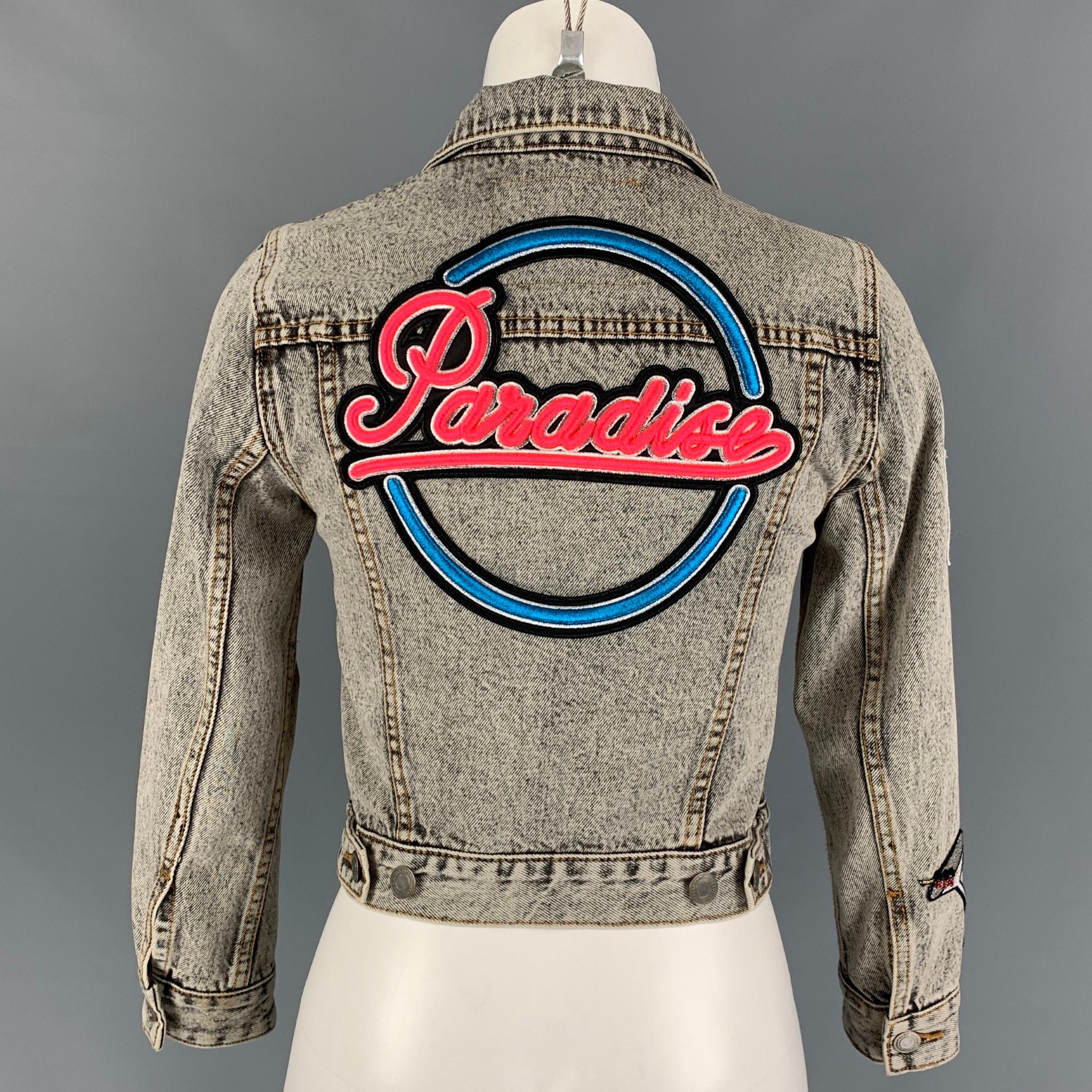 denim jacket with pins and patches