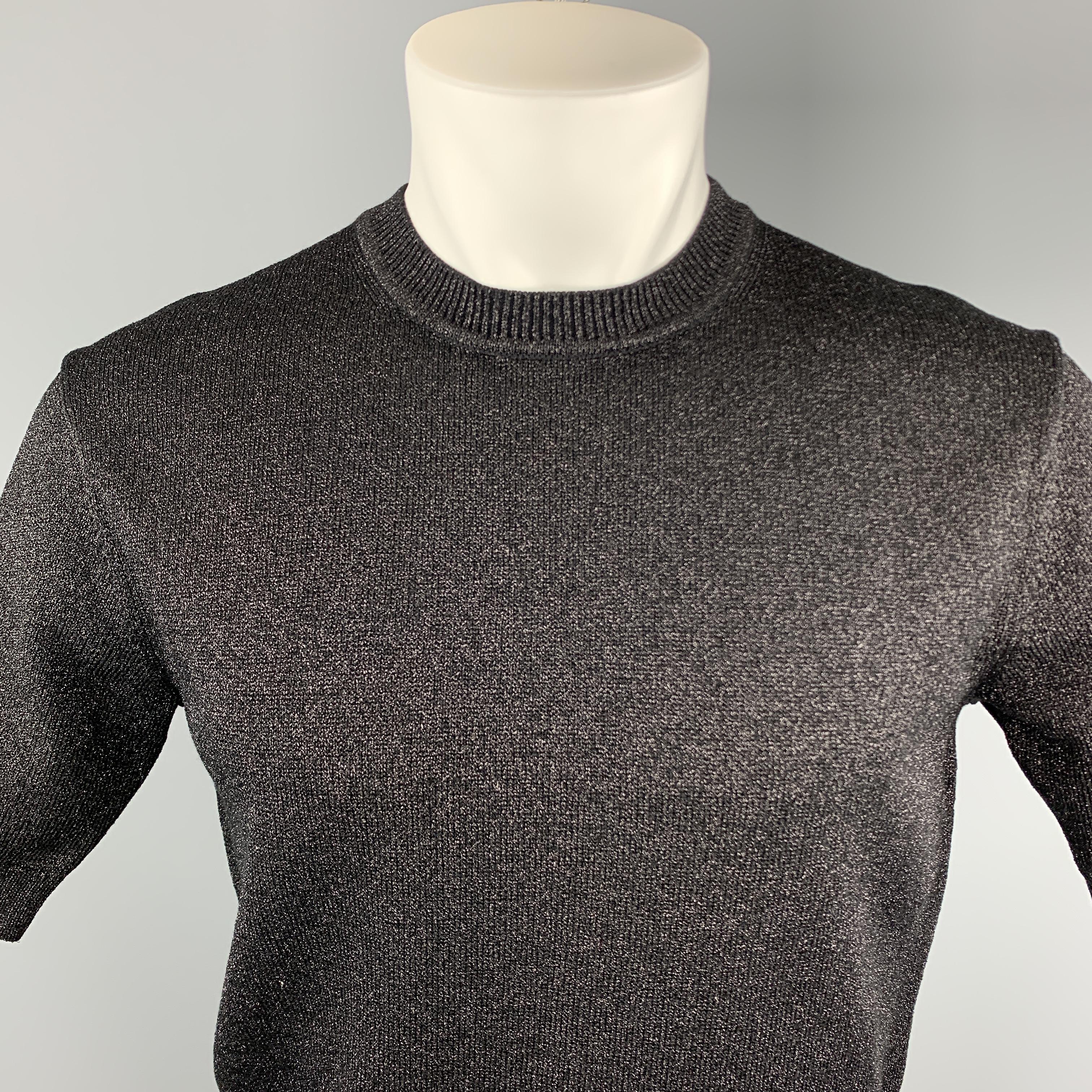 MARC JACOBS pullover comes in a black knitted metallic viscose blend featuring a short sleeve style and a ribbed crew-neck. Made in Italy.

Excellent Pre-Owned Condition.
Marked: XS

Measurements:

Shoulder: 18 in. 
Chest: 38 in. 
Sleeve: 11 in.