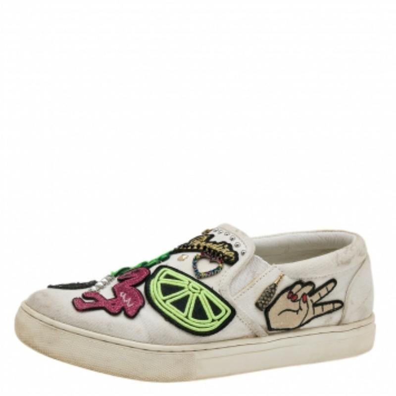 Essay your high style with these sneakers from the house of Marc Jacobs! They are finely crafted from canvas and designed with round toes as well as eye-catching embellishments and patches that adorn the exterior. You are sure to receive both