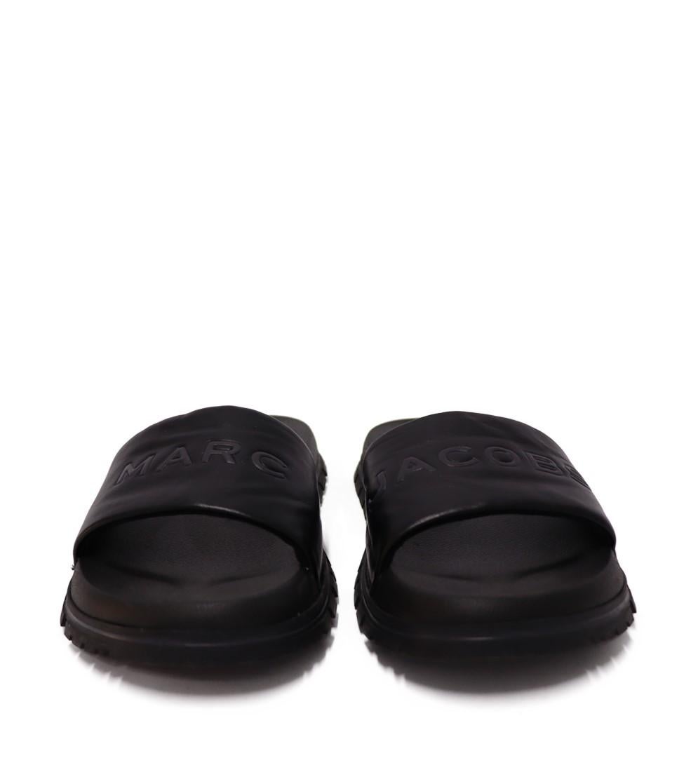 Marc Jacobs Women's Leather Slides, slip-on style features a logo-embossed upper.

Material: Leather.
Size: EU 40
Overall Condition: Excellent.
Interior Condition: Like New.
Exterior Condition: Like New.
