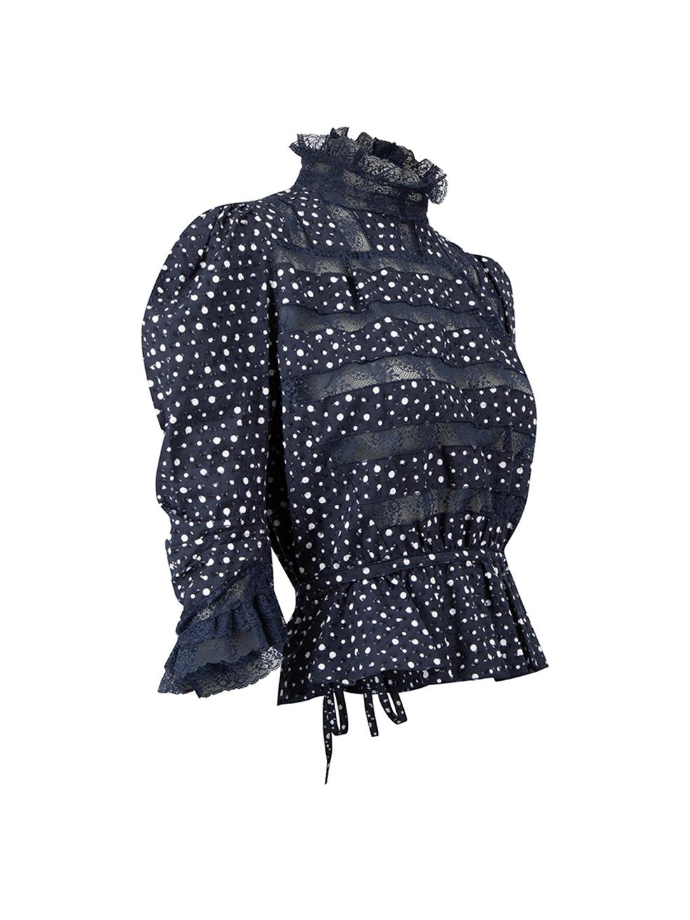 CONDITION is Very good. Hardly any visible wear to blouse is evident on this used Marc Jacobs designer resale item. 
 
 Details
  Navy
 Cotton
 Long sleeves blouse
 Polkadot pattern and textured
 Mock neck
 Lace detail
 Tie waisted
 Back buttons