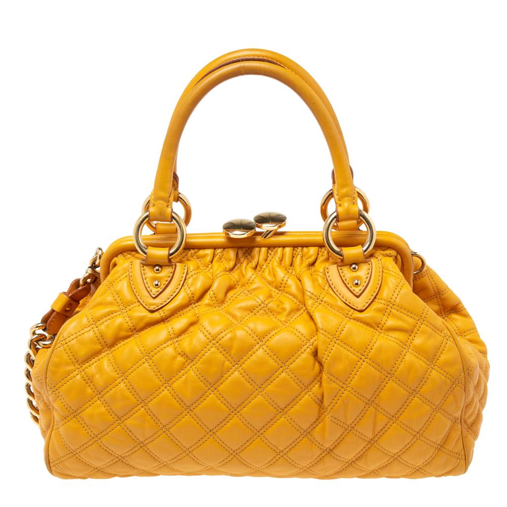 Easy to carry and stylish in appearance, this Stam satchel from the House of Marc Jacobs will certainly be your favorite pick this season. It is crafted using yellow quilted leather, with gold-tone hardware elevating its beauty. It provides two