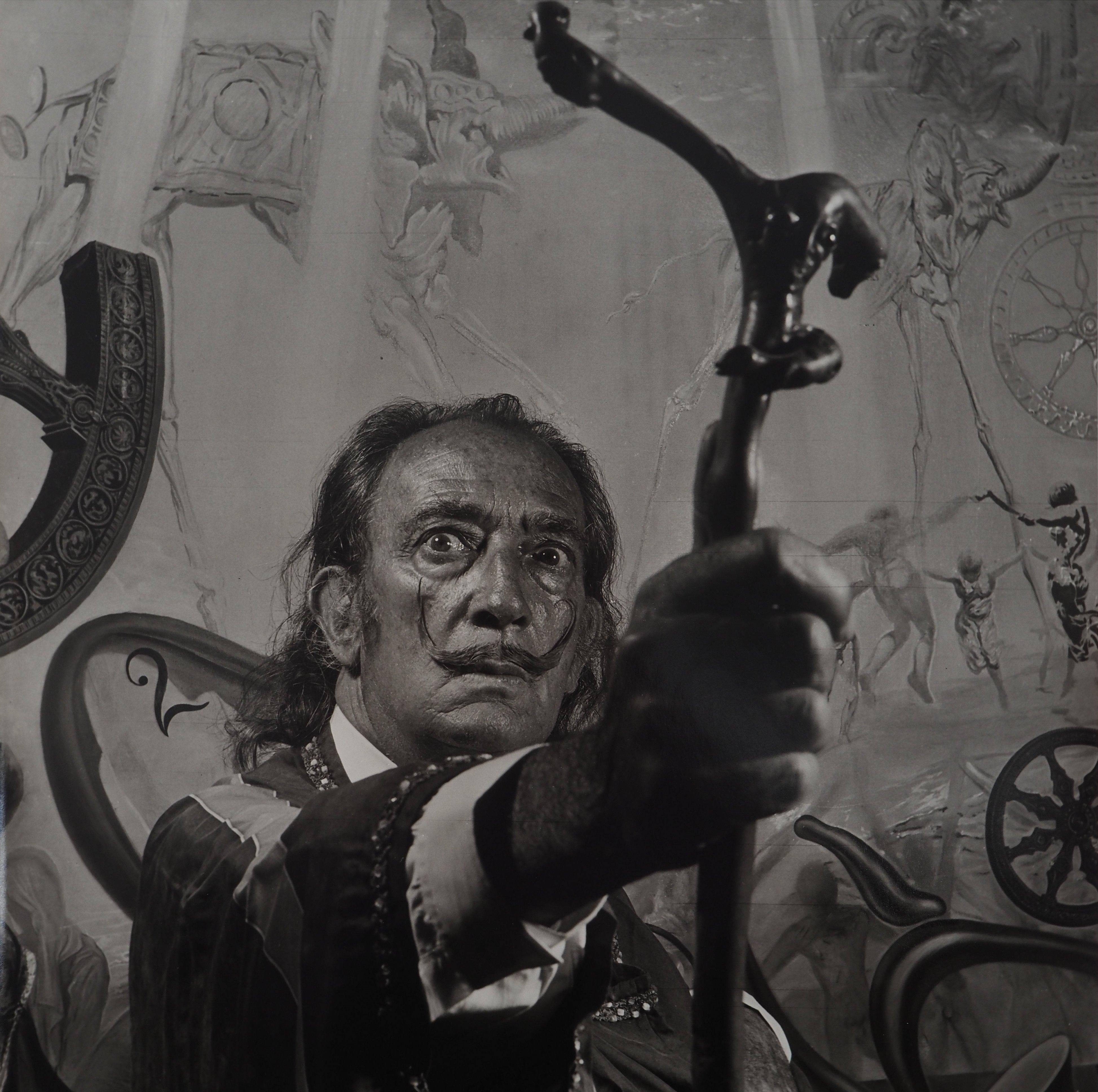 Dalí Holding his Walking Stick - Original Gelatin Silver Photography - Black Portrait Photograph by Marc Lacroix