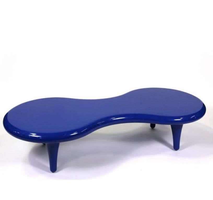Elevated above four legs, the Orgone table by Marc Newson is made of fiberglass with a poplar fiberglass insert. The silhouette is evocative of a surfboard, one of the designer’s greatest passions; suitable for outdoor use, the Orgone table is