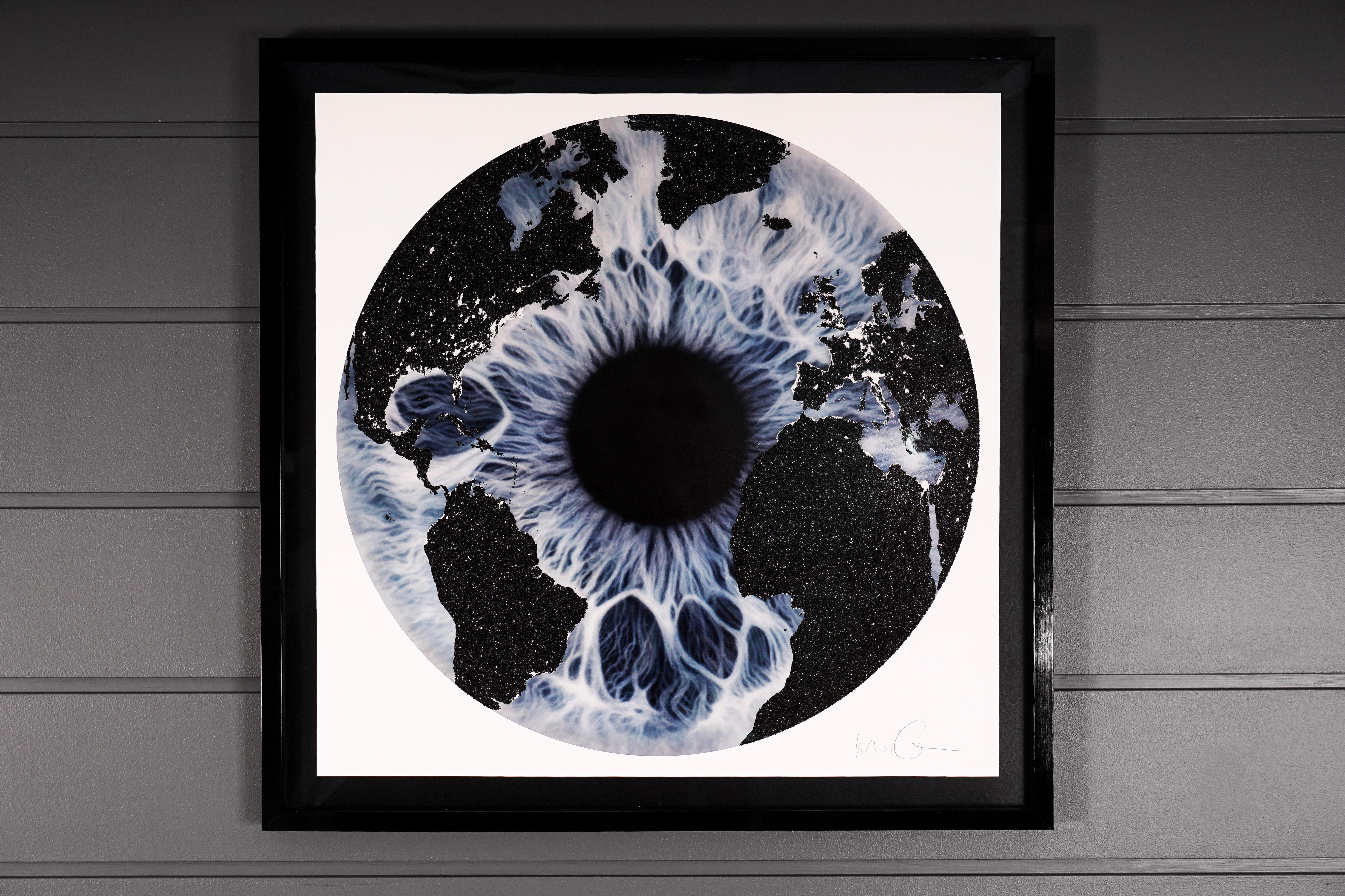 'Blue Iris with Diamond Dust', created in 2019 by Marc Quinn. The piece features a blue iris with an overlay of a world map covered with a brilliant layer of shimmering Diamond Dust. This silkscreen print is an exclusive edition of only 15. The