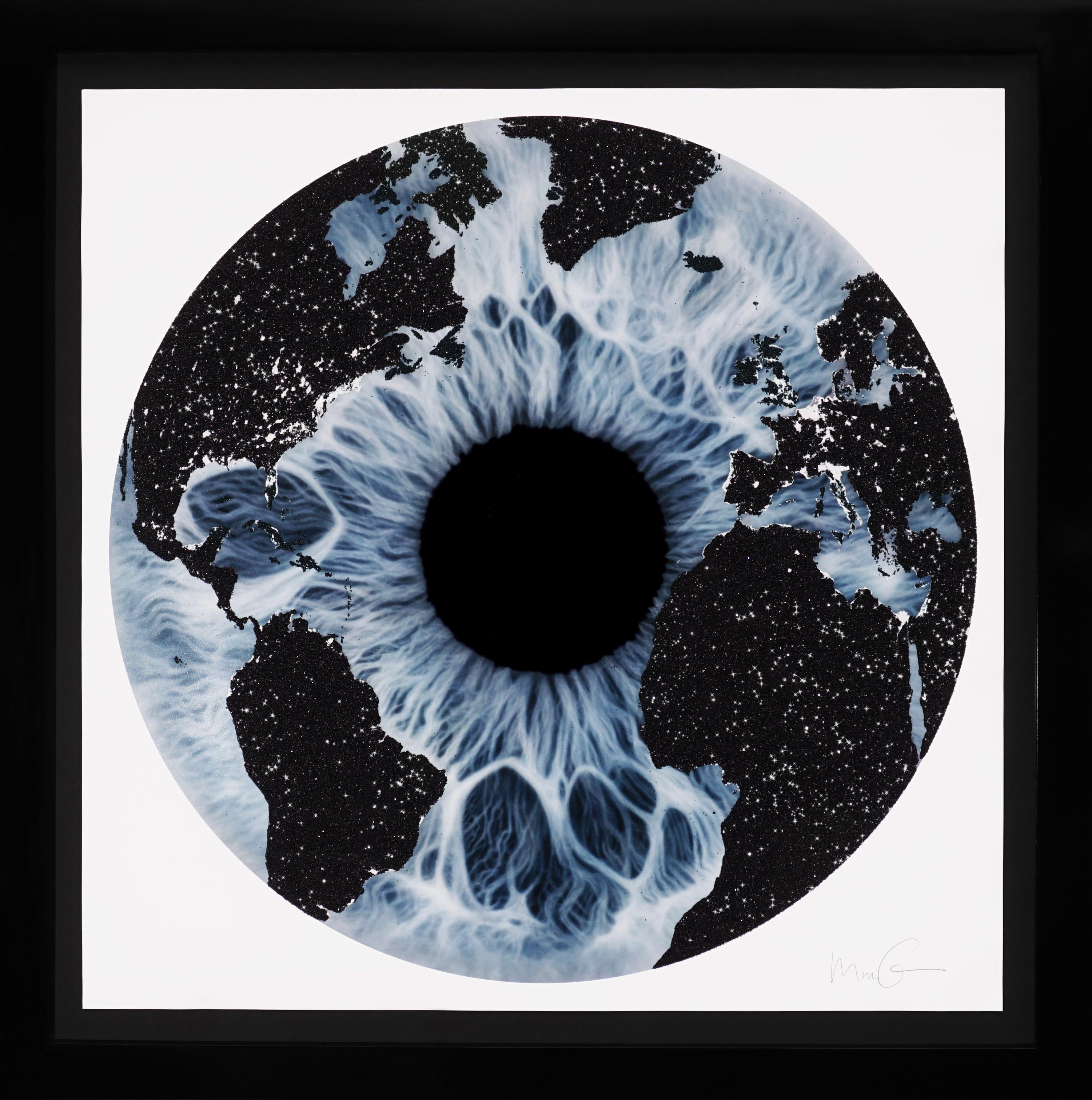 The 'Iris' in icy blue and black is a silkscreen print with Diamond Dust on paper created in 2019 by Marc Quinn. The piece features a mystical blue iris with a glittering black diamond dust overlay in the shape of the earth's geography. This signed