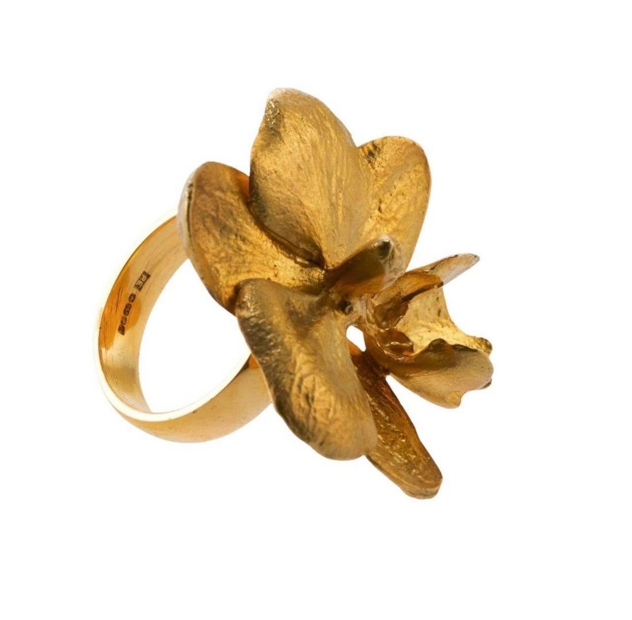 Marc Quinn 
18k Large Gold Orchid Ring
Measurements: Ring size 7, ring top is 38mm x 37mm 
Hallmarked: MQ PE 750 
Weight: 26 grams 


Quinn has used orchids repeatedly and thematically in his sculptures and these unique pieces are inspired by the