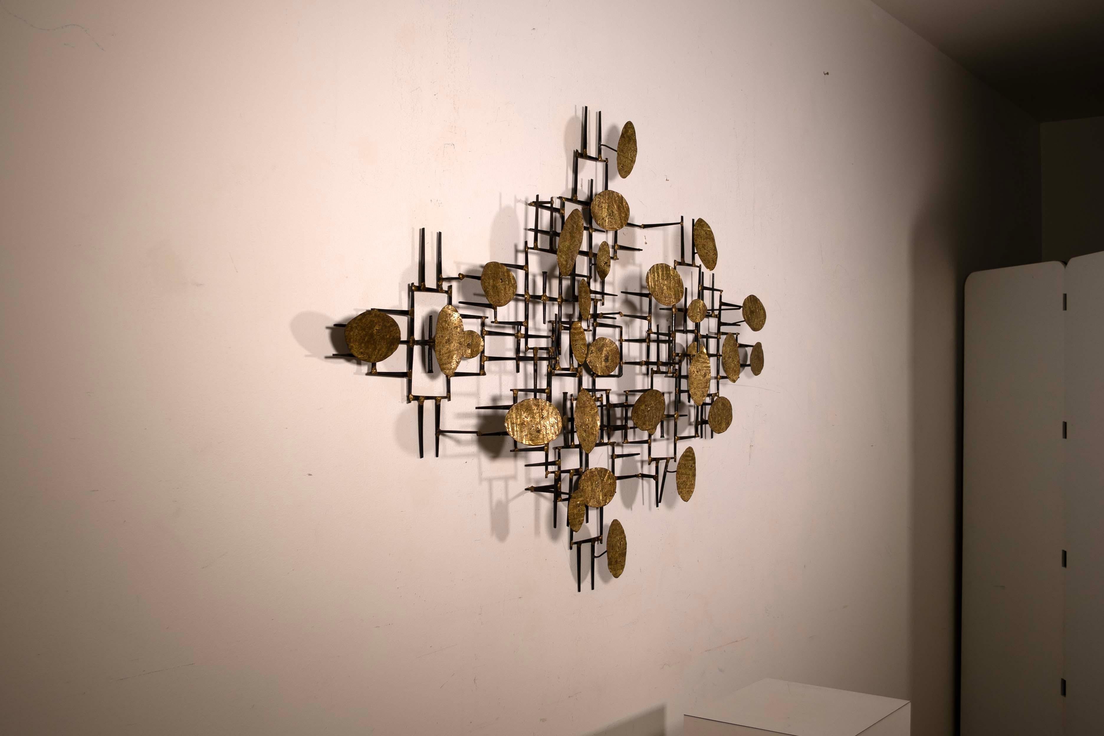 Stunning and sculptural, this Marc Weinstein Creates Style Brutalist Wall Sculpture is an embodiment of the bold and textured aesthetics of the Mid-Century Modern movement. The complex interplay of abstract metal shapes and the warm, earthy tones of
