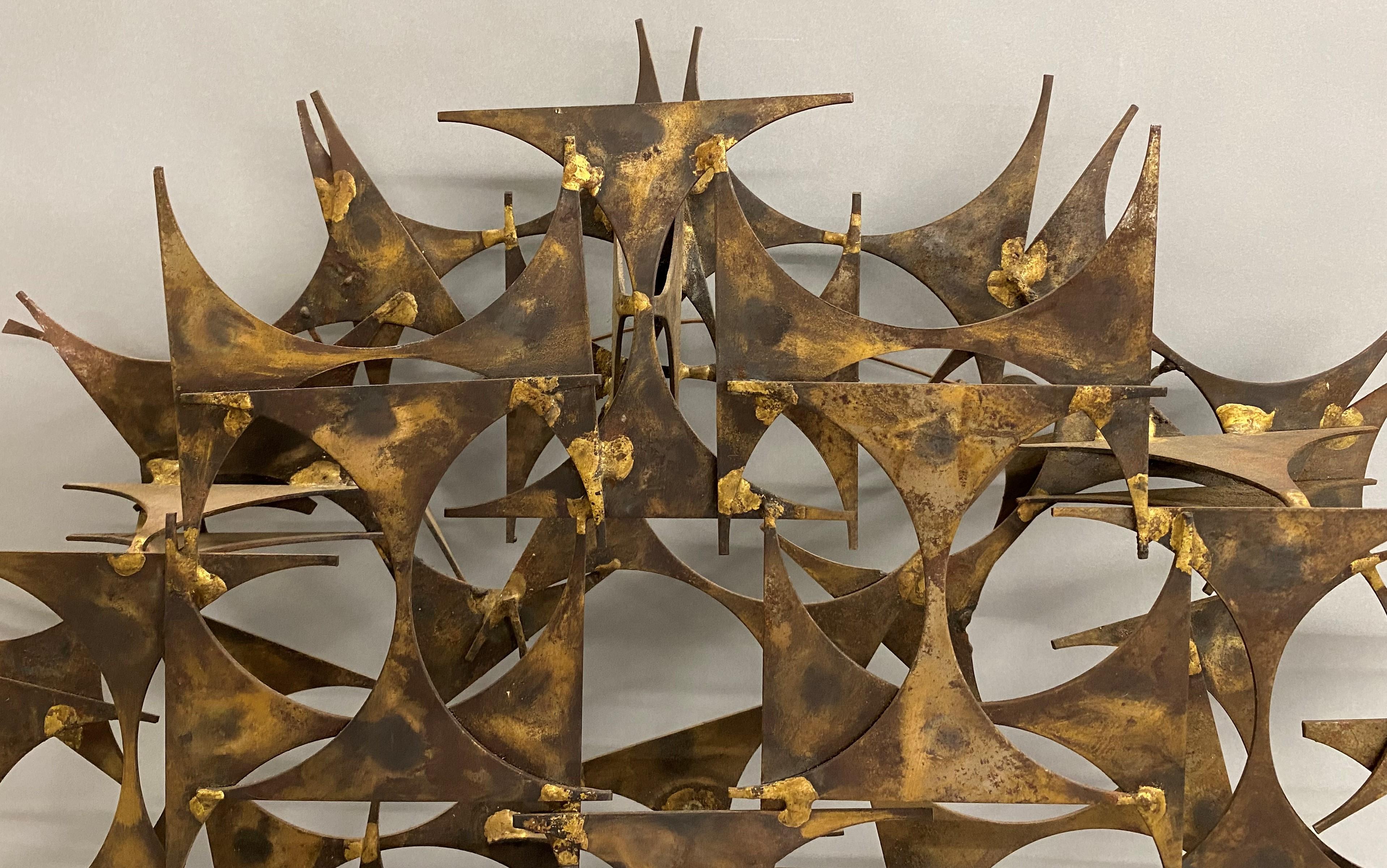 A fine brutalist abstract sunburst three dimensional metal sculpture by American artist Marc Weinstein (20th/21st c). Weinstein began working for his father at Federal Salvage and Supply in St. Louis in 1957, he had a hard time seeing the scrap