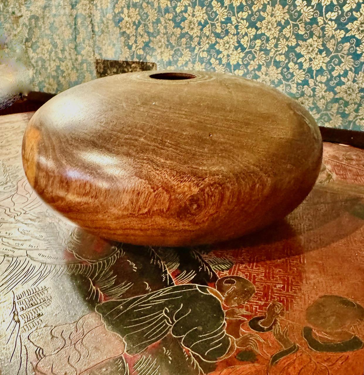 This is a beautifully elaborated and finely carved splatted mesquite wood  vessel that has been polished to a satin smoothness and inlaid with turquoise by the listed Arizona Artist, Marc Wroe. The vessel is artist signed and dated 4/1994. The
