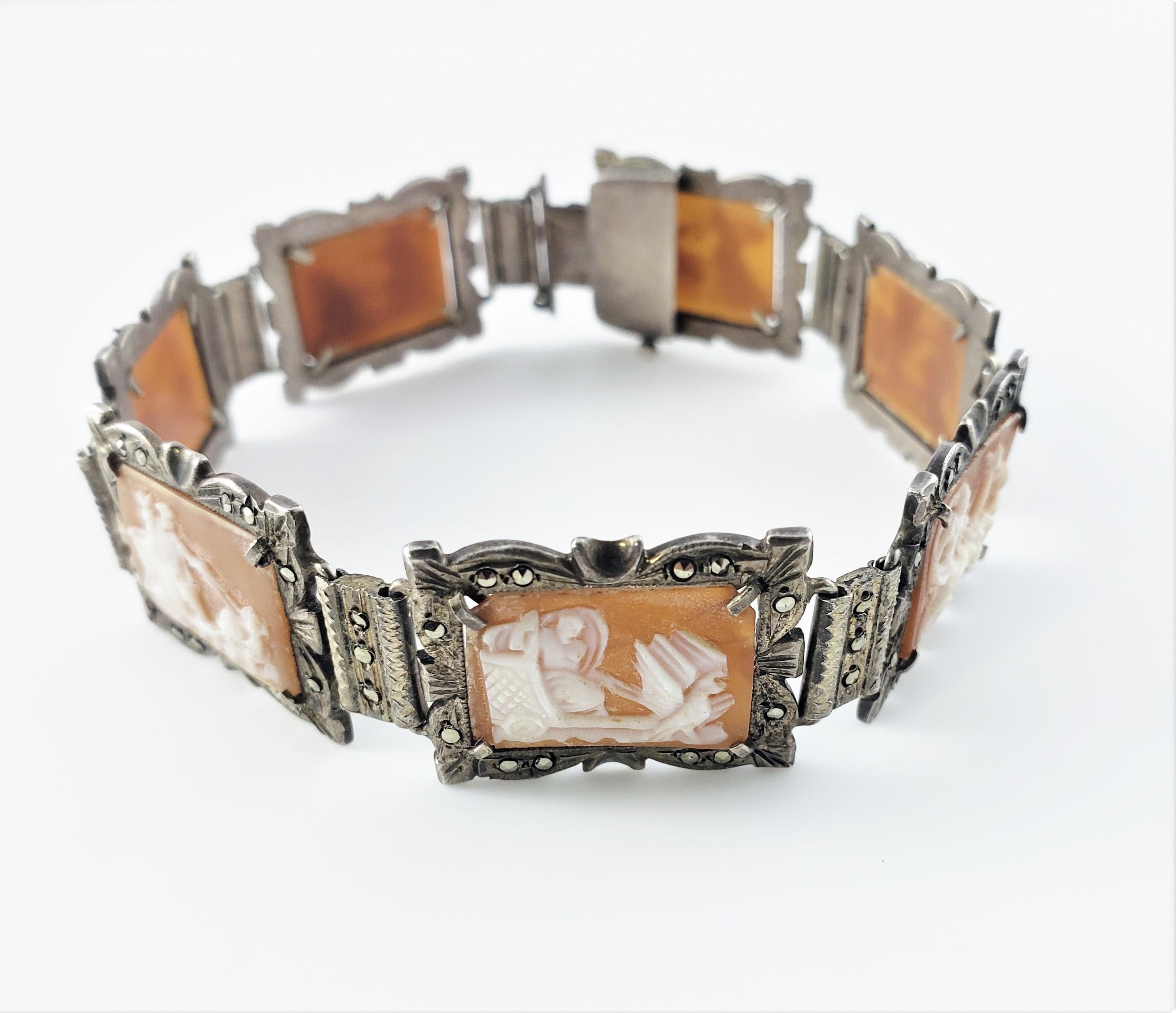 Vintage 800 Silver Marcasite Abalone Panel Link Cameo Bracelet-

This lovely silver cameo bracelet features seven panels each featuring a chariot scene crafted in beautifully detailed abalone and marcasite.

Size: 7.75