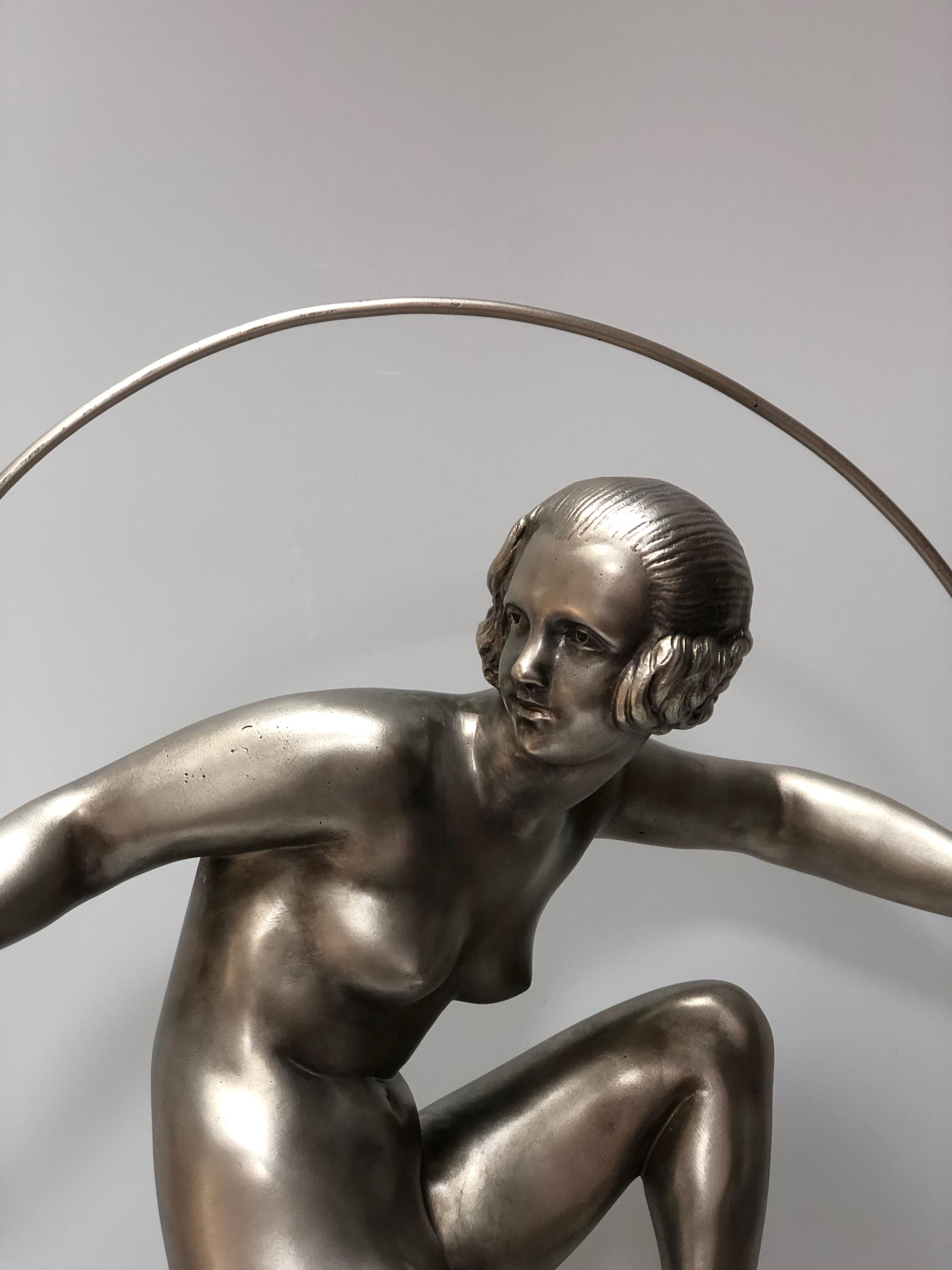 Silvered bronze on art deco marble base circa 1930.
Dancer with a hoop, signed on Bourraine marble.
In perfect condition.
Total height: 50 cm
Dancer height: 31 cm
Base width: 12 cm
Base length: 12 cm
Weight: 7 Kg

Born in 1886 in Pontoise, France,