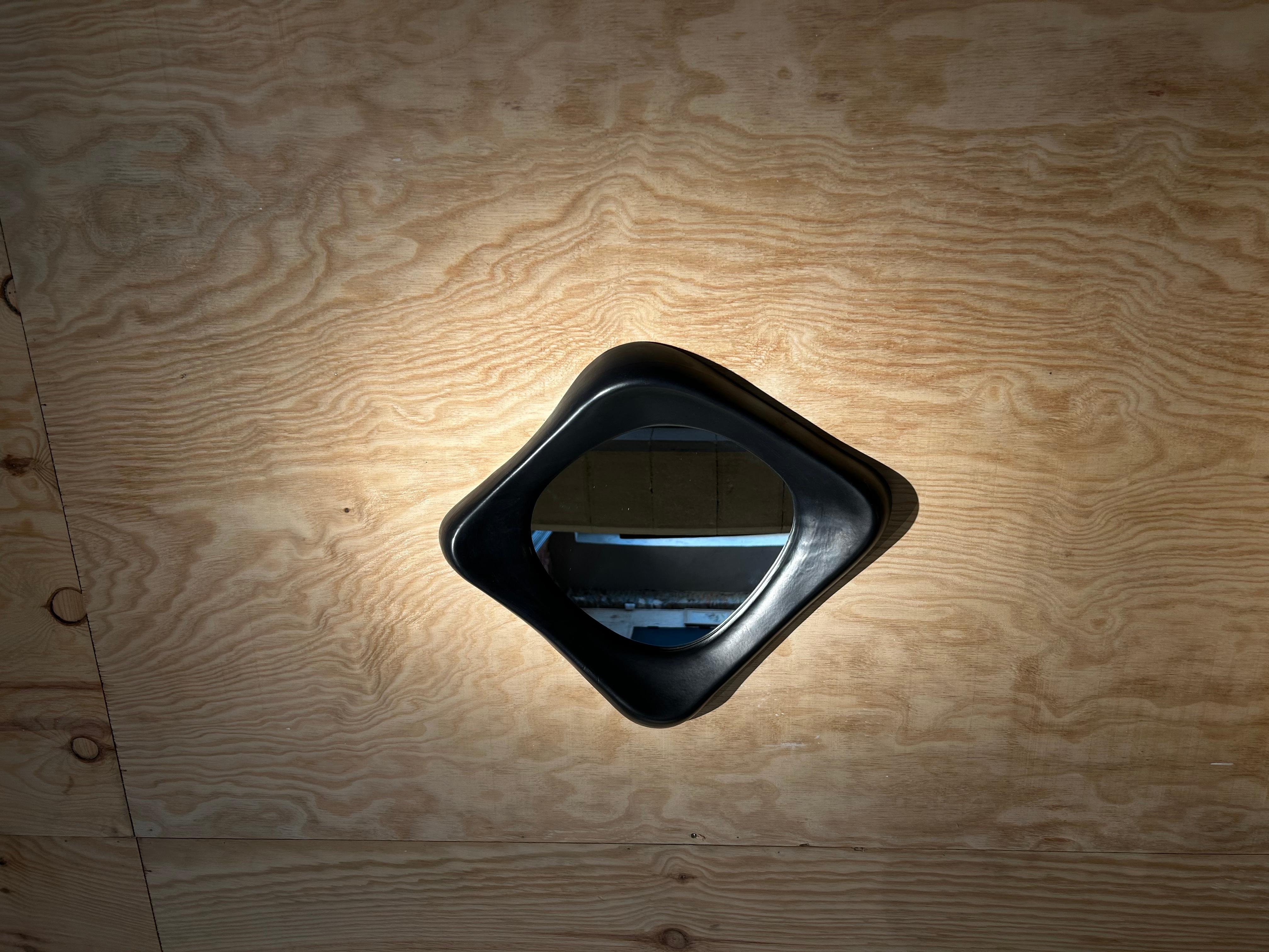 Black ceramic Mirror by Marcel Asselbur 
Attributed to Georges Jouve circa 1950
Perfect condition 