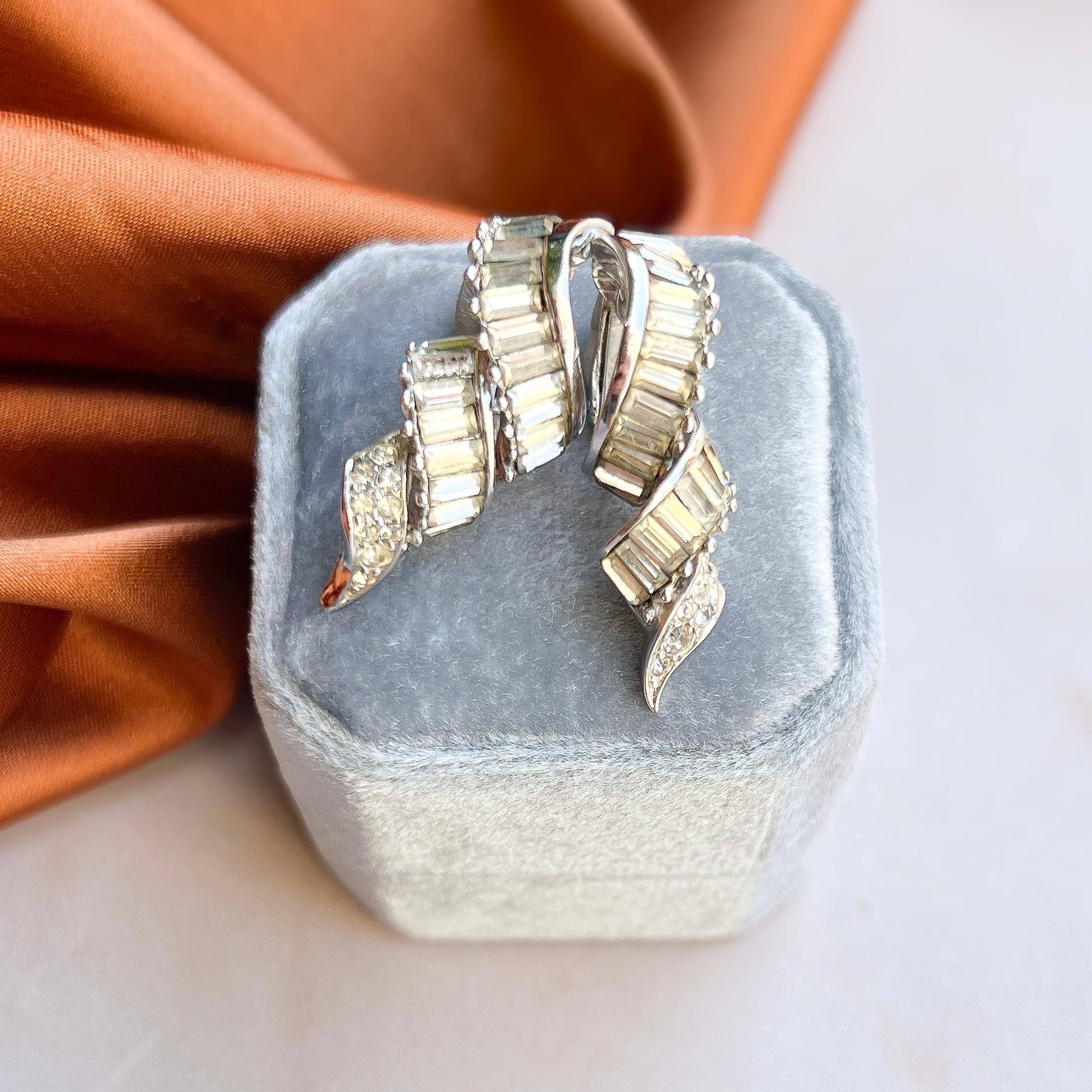 These timeless and elegant earrings were created by Marcel Boucher in the 1950s.  

Condition Report:
Very Good - A little darkening to a couple of the rhinestones due to ageing. This is only apparent upon very close examination and does not detract