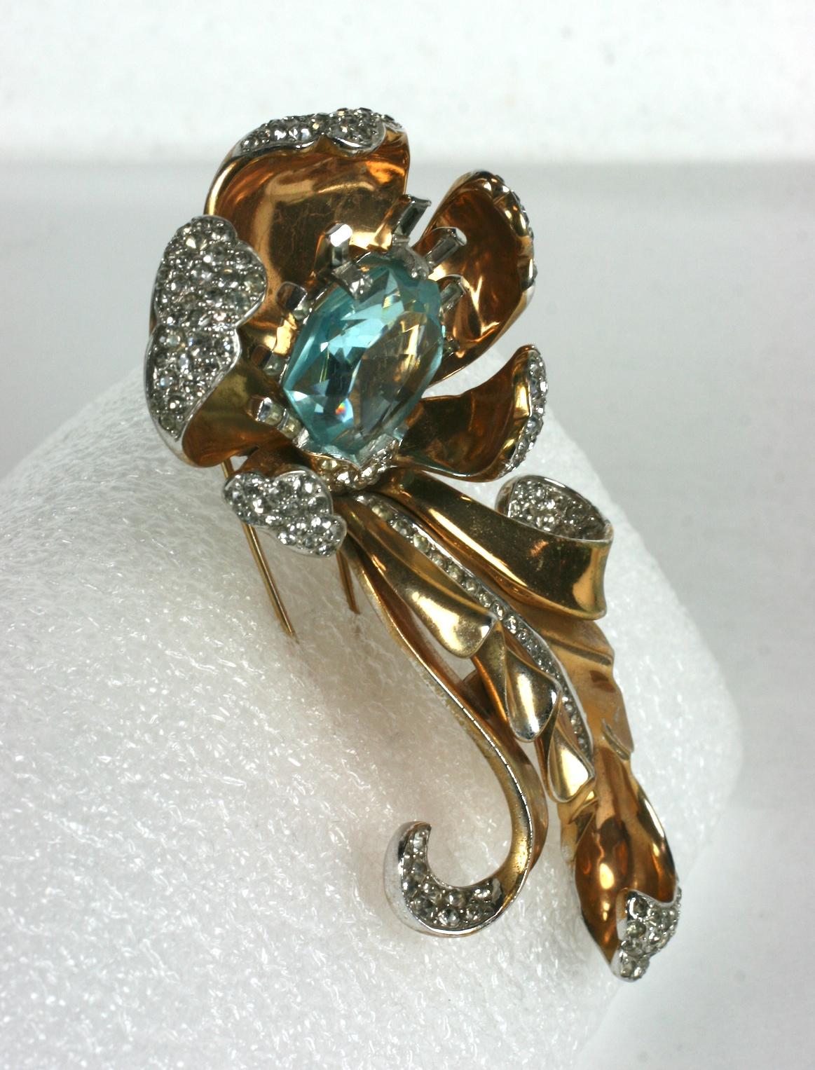 Marcel Boucher massive retro faux aquamarine floral clip brooch. Of gold over rhodium plate base metal, crystal rhinestone pave with rectangular baguette accents..
Excellent Condition, Unsigned.
Length 4.25