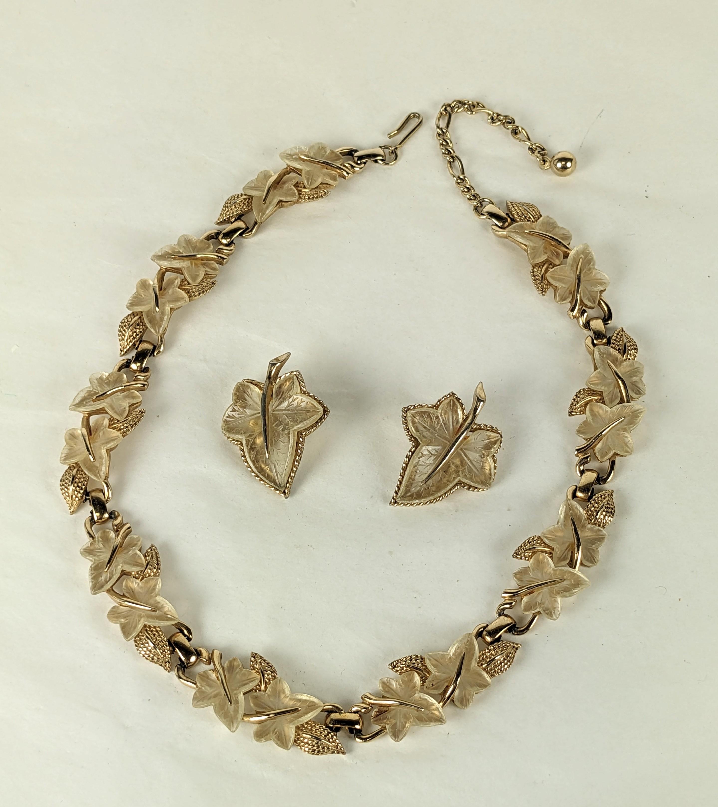 Marcel Boucher Frosted Leaf Necklace and Earring Set from the 1960's. Ribbed gilt metal with frosted glass leaves set into an alternating pattern. 1960's USA. 
Necklace 14