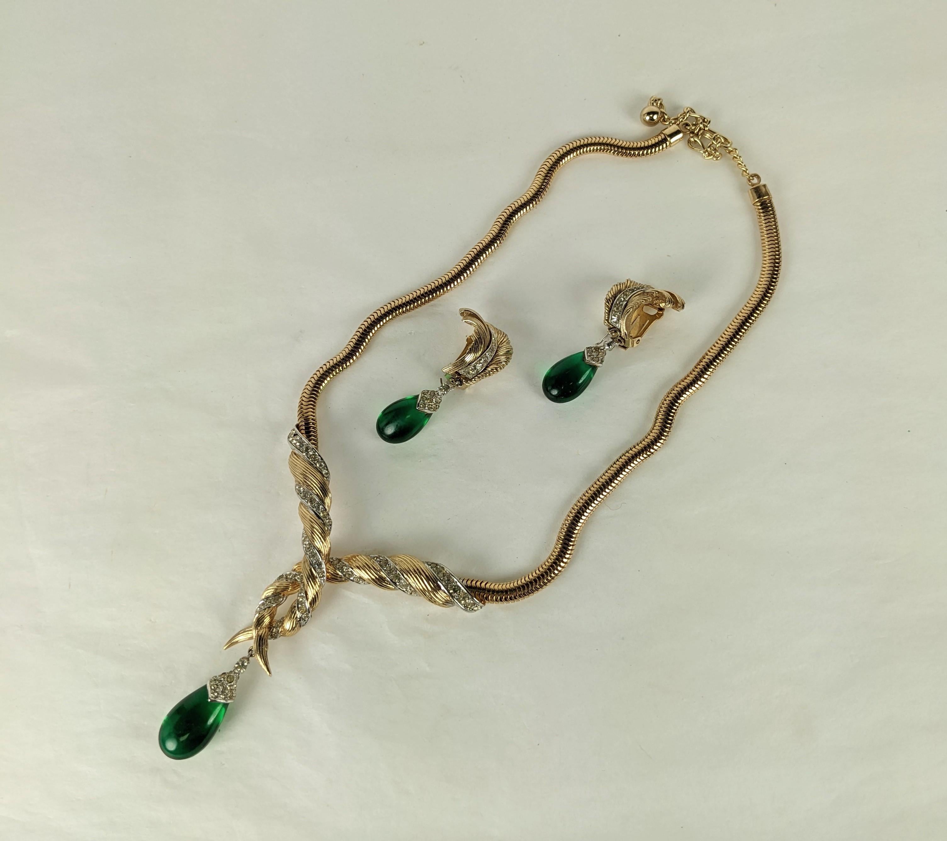 Attractive Marcel Boucher Gilt Pave Emerald Drop Necklace and Earrings from the 1950's. Lovely retro style design has matching clip earrings with a feather motif.  Central crossover motif is hinged for comfort.  All pieces signed Boucher.  1950's