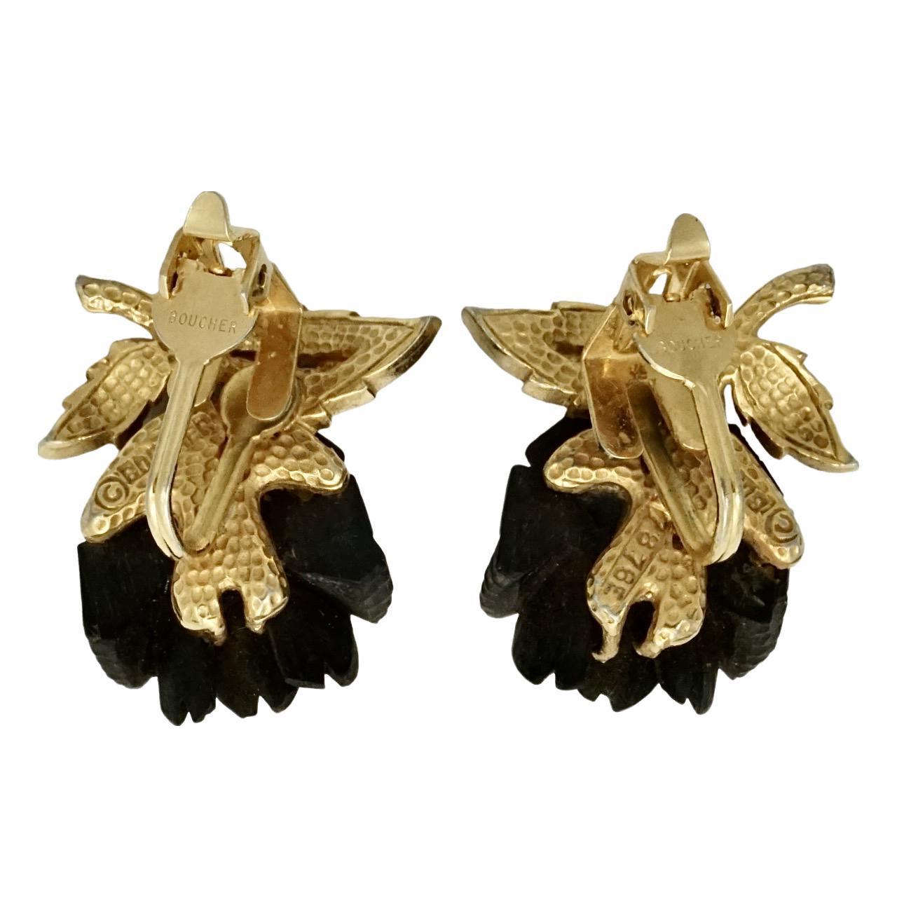 Marcel Boucher beautiful gold plated clip on earrings, featuring black roses. Measuring length 2.8 cm / 1.1 inches by width 2.3 cm / .9 inch. Possibly the clip fitting is not original.

This is a beautiful pair of black rose earrings by Boucher.