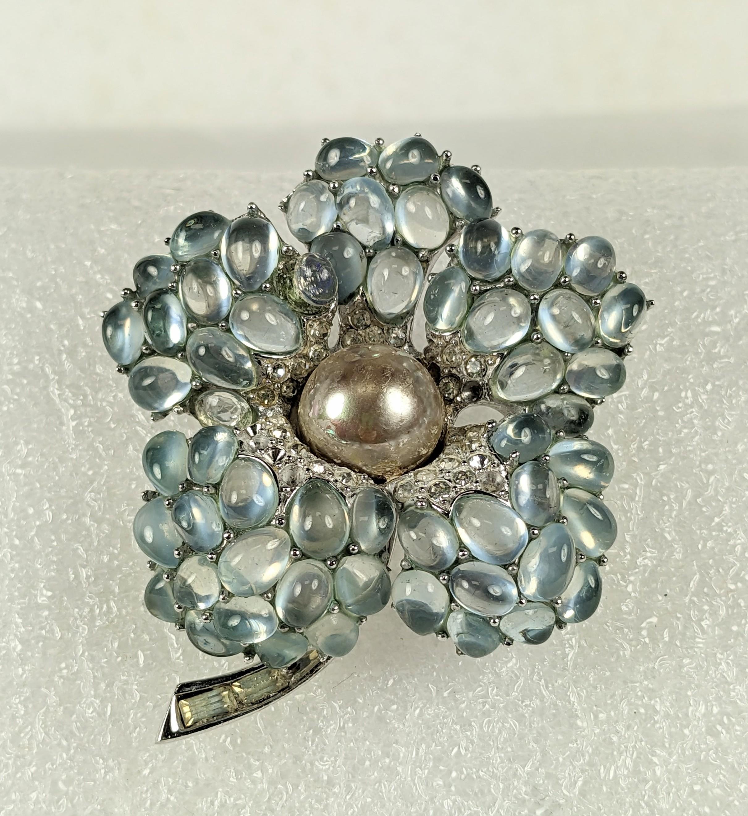 Dimensional, beautiful Marcel Boucher Moonstone Cab Flower from the 1960's. High rhodium with faux moonstones and pave with large faux pearl. 1960's USA. 2.5