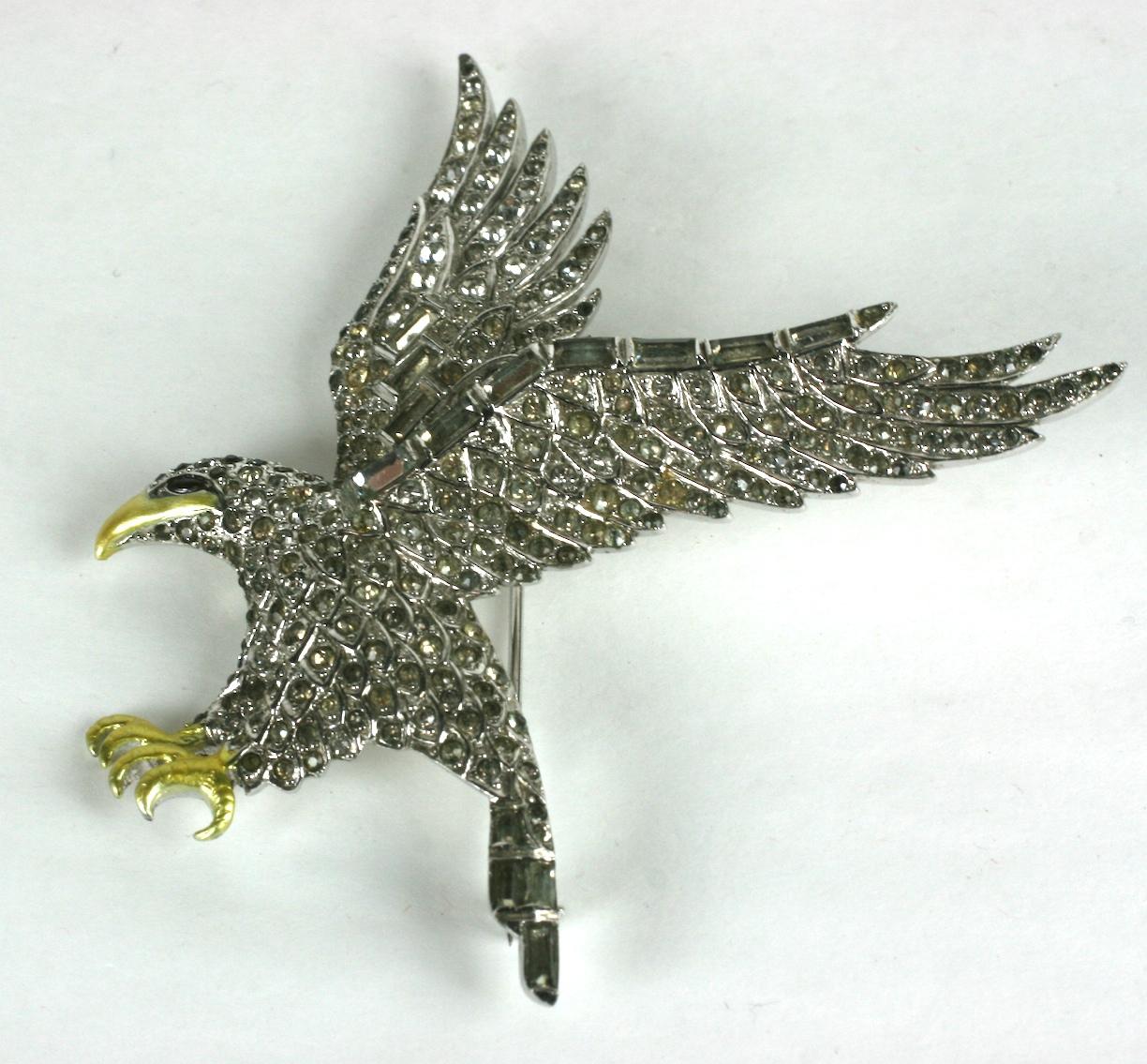  Marcel Boucher Patriotic  Pave Swooping Eagle brooch of  rhodium plate base metal, crystal rhinestone pave and cold pearlized enamel accents. 
Reference:  advertised for sale at the Broadway Hollywood, price $24, in the Los Angeles Times, 16 Sept