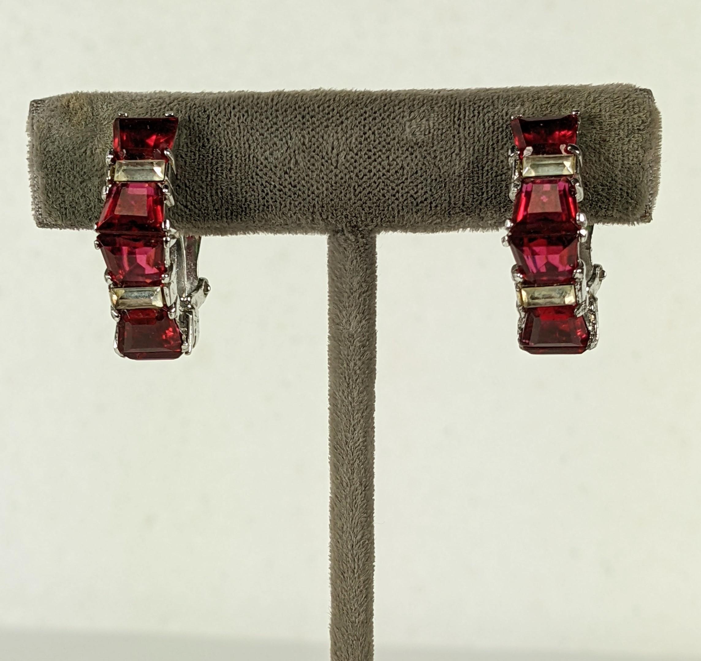 Early Boucher Faux Ruby Earrings in sterling with rhodium plate finish. Faux rubies are channel set in a half hoop form with baguettes in between. Marked 