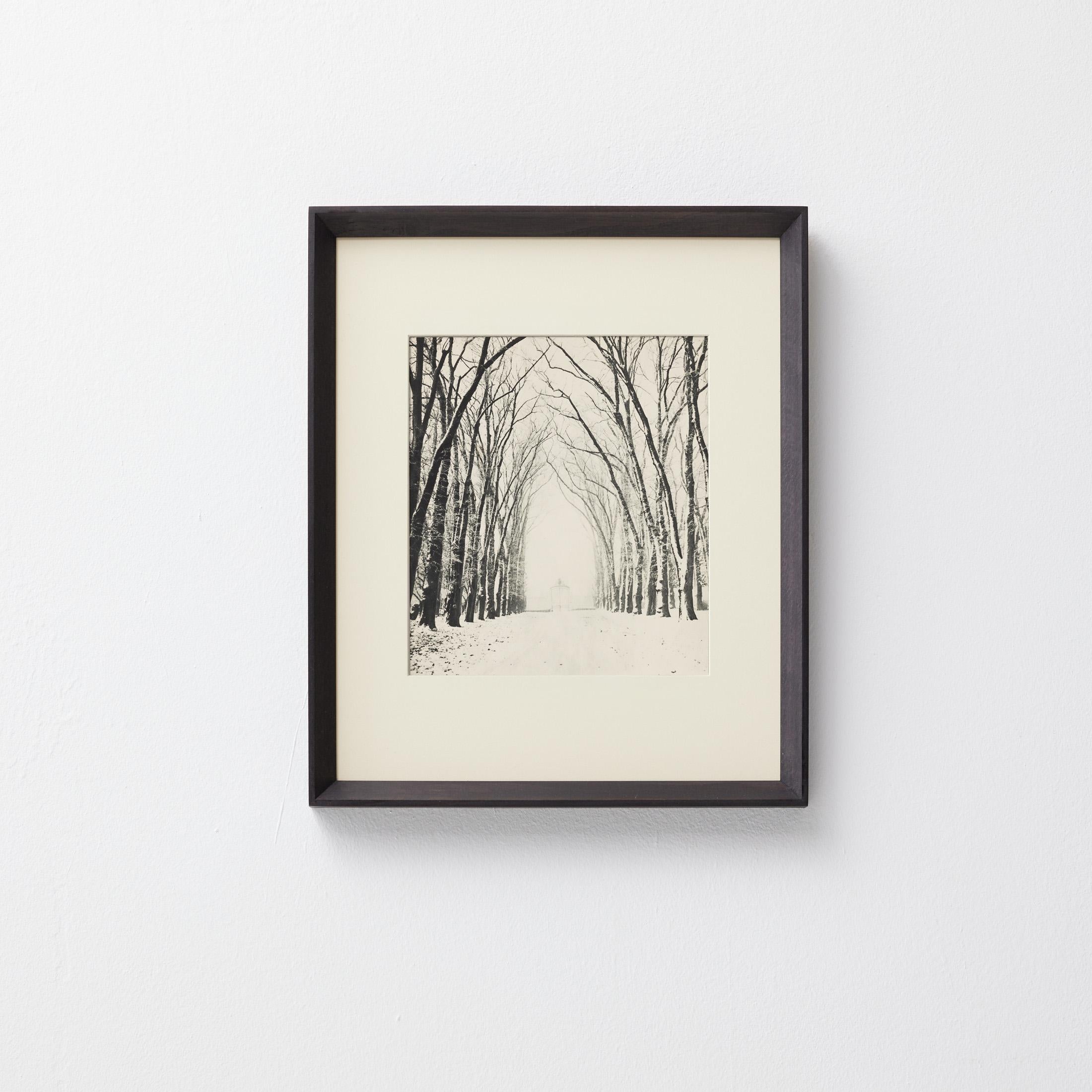 Original heliogravure published in the first edition of Verve (Vol. 1, No. 1, 1937), the celebrated Parisian art magazine founded by Tériade. This poetic image by French photographer Marcel Bovis captures a serene snow-covered avenue lined with bare