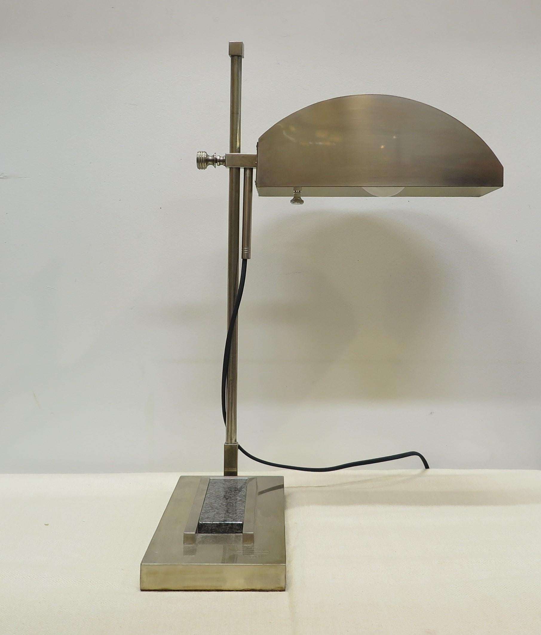 Bauhaus Articulating desk lamp by Marcel Breuer. Designed for the International Exposition of Modern Industrial and Decorative Arts, in Paris 1925, number 44 of 100. Articulating movement up and down with full 360 rotation. Composed of brass plated