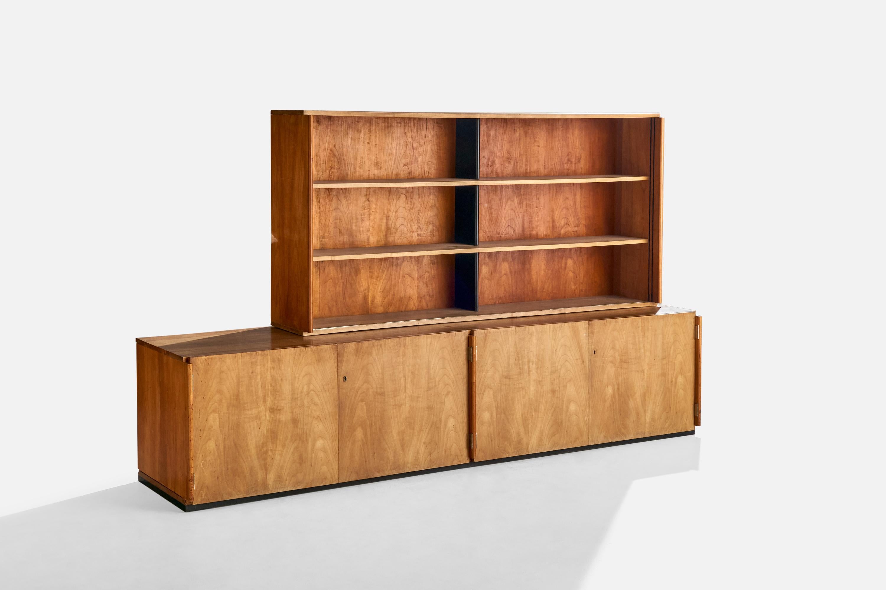 A cherry-veneered wood and glass cabinet or sideboard attributed to Marcel Breuer. Present cabinet was produced for the apartment of Fred Forbát, Zehlendorf, Berlin, Germany, c. 1925.

Provenance:

Fred Forbát, Zehlendorf, Berlin
Andor and Catherine