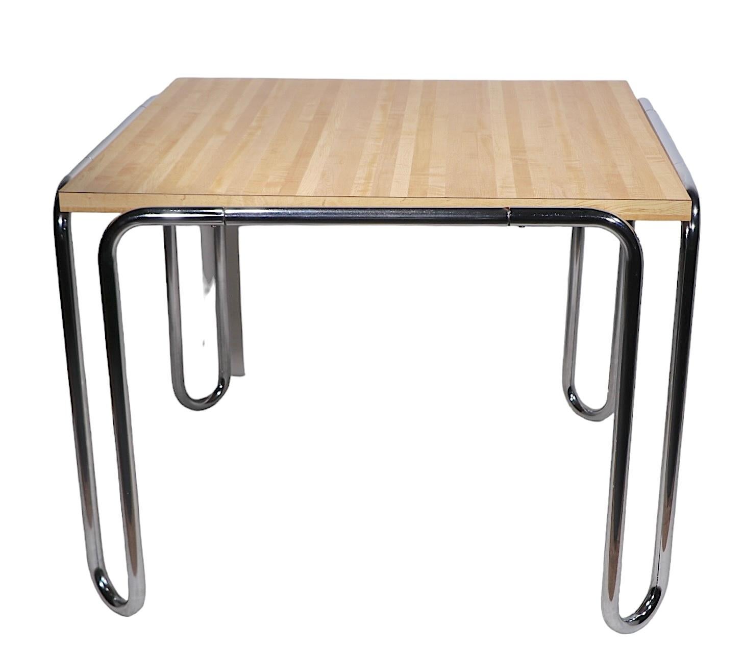 Marcel Breuer design, Bauhaus style tubular chrome and formica dining table model B 10. The table features a continuous leg of U shape, which support a faux butcher block top constructed of formica laminate. 
  We believe this example was made in