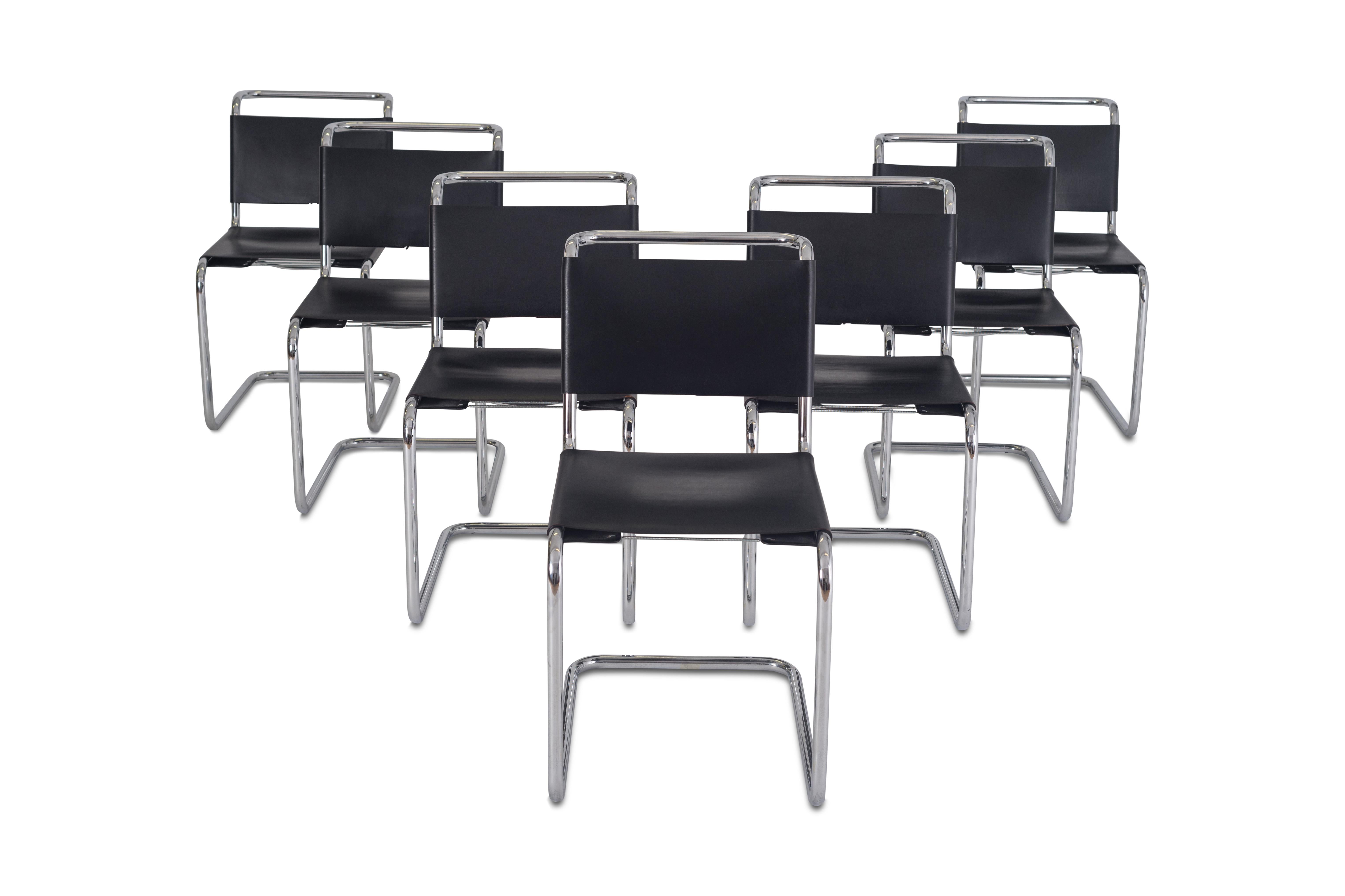 Knoll International dining chairs by Marcel Breuer B33 

The thick perforated black leather seat and backrest are held together by a small elegant lace, and are supported by a chrome tubular frame. Set of seven chairs in amazing condition. 

 