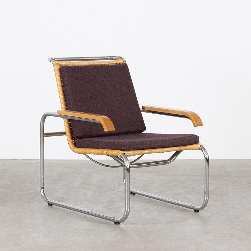 Iconic Bauhaus B35 lounge armchair designed by Marcel Breuer and manufactured by Thonet. Woven original rattan and cantilever chrome plated frame and solid wooden armrests The chair is in very good condition with only light traces of use. The wolen