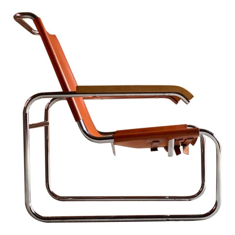 Marcel Breuer B35 lounge chair by Thonet, circa 1930s 

Stunning Bauhaus design Marcel Breuer B35 armchair by Thonet circa 1930s, the cantilever frame with original tan leather seat, wooden armrests with a chromed tubular steel frame, a classic