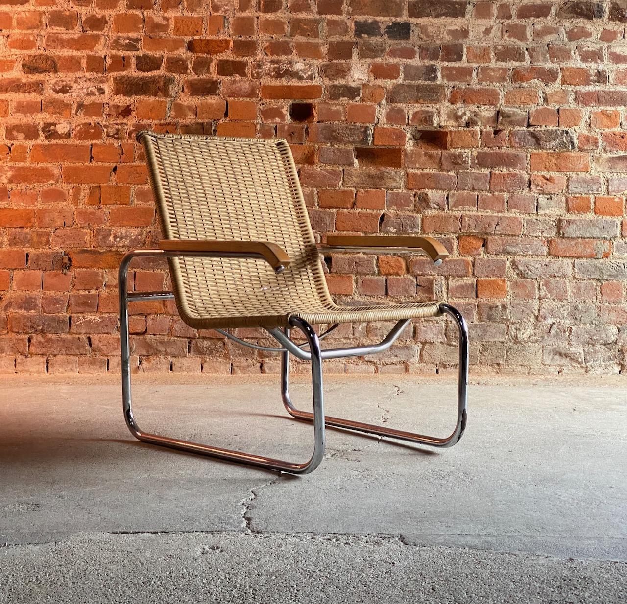 Marcel Breuer B35 lounge chair armchair by Thonet Bauhaus, circa 1940s 

Sublime Bauhaus design Marcel Breuer B35 armchair by Thonet circa 1940s, the cantilever frame with woven rattan seat, wooden armrests with a chromed tubular steel frame, the
