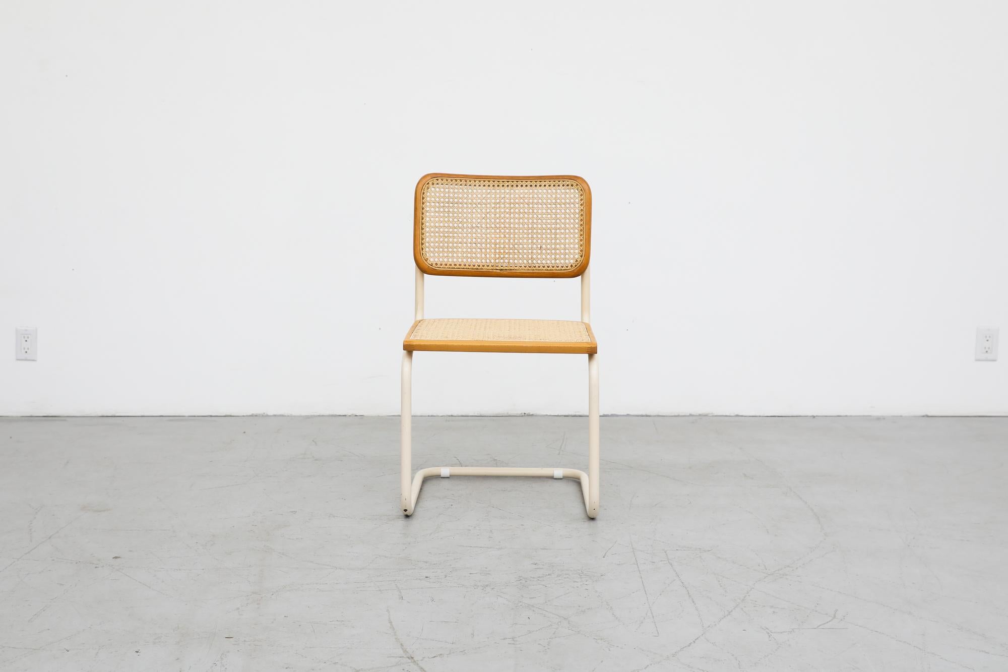 Classic 'B64' Cesca side chair by Marcel Breuer for Gavina Italy, circa 1960's. Named after his daughter Francesca, this 'Cesca' has an off-white painted metal frame with newly caned seat, original cane back and oak wood trim. In overall original
