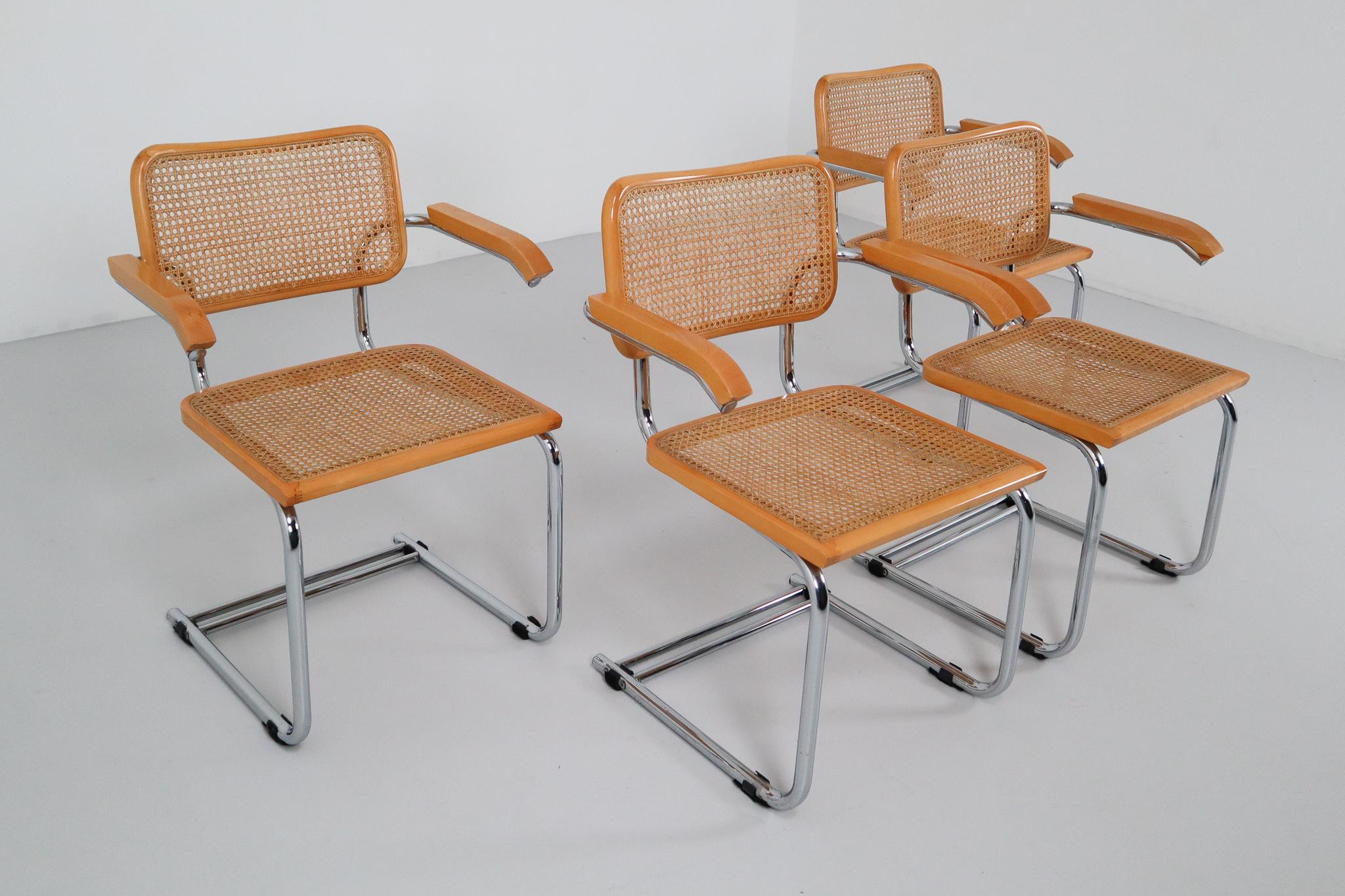 Beautiful set “Cesca” armchairs by Marcel Breuer, manufactured in Italy. Black finish cane seats and backs. Classic chrome cane. Caning very good condition and a beautiful Carmel color. Made In Italy. Cesca chairs were originally designed in 1928 by