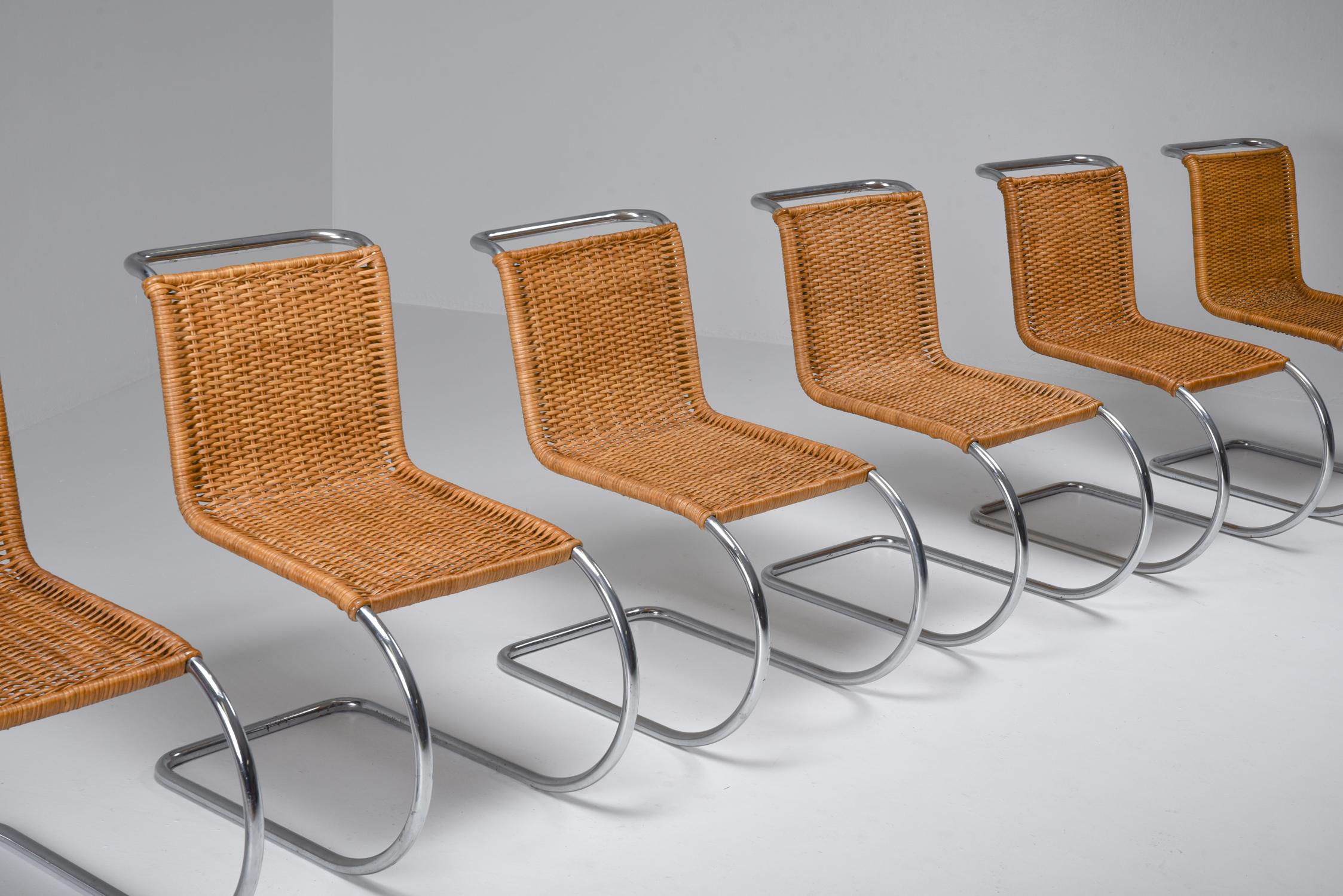 Marcel Breuer dining chairs Mid-Century Modern;
Chromed metal and rattan armchair by Marcel Breuer for Thonet.

Marcel Lajos Breuer (21 May 1902-1 July 1981), was a Hungarian-born modernist architect, and furniture designer. At the Bauhaus he