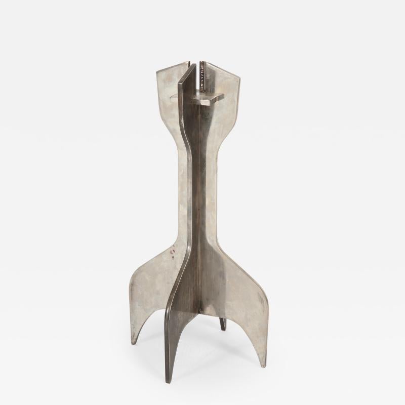 Nickel Plated Steel Candlestick by Marcel Breuer for Gavina. These were originally made as gifts by Dino Gavina. At some later date they were put into production. Made from 3 interlocking metal pieces. Taken apart it can pack flat.

Additional