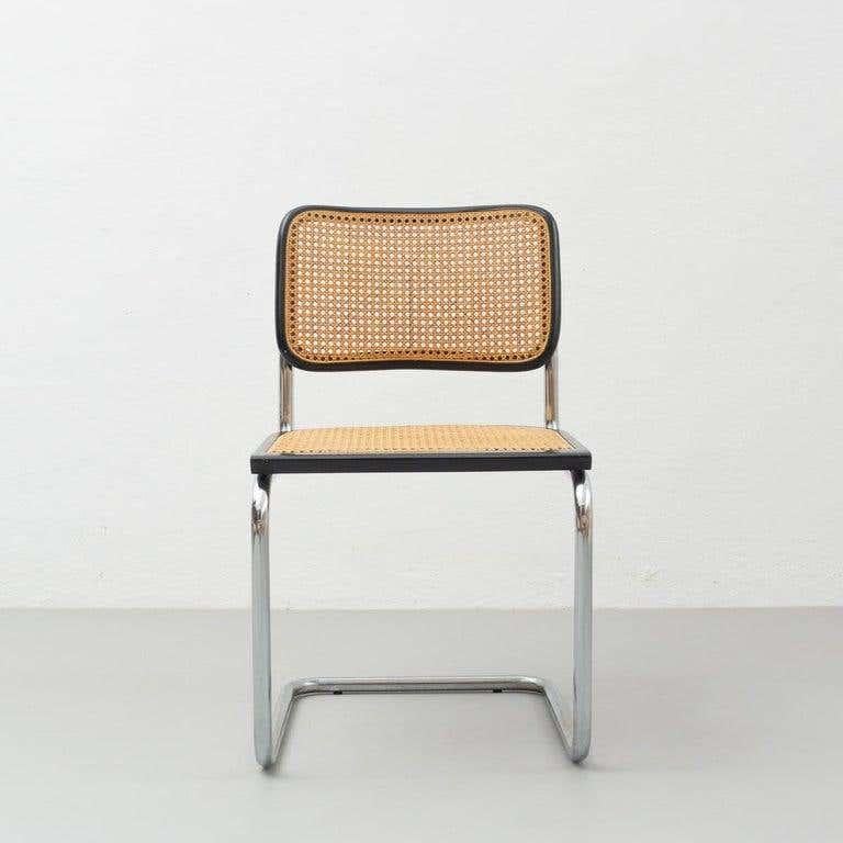 Chair model cantilever, designed by Marcel Breuer circa 1960, by unknown manufacturer.
Metal pipe frame, wood seat and back structure and rattan.

In original condition, with minor wear consistent with age and use, preserving a beautiful patina.