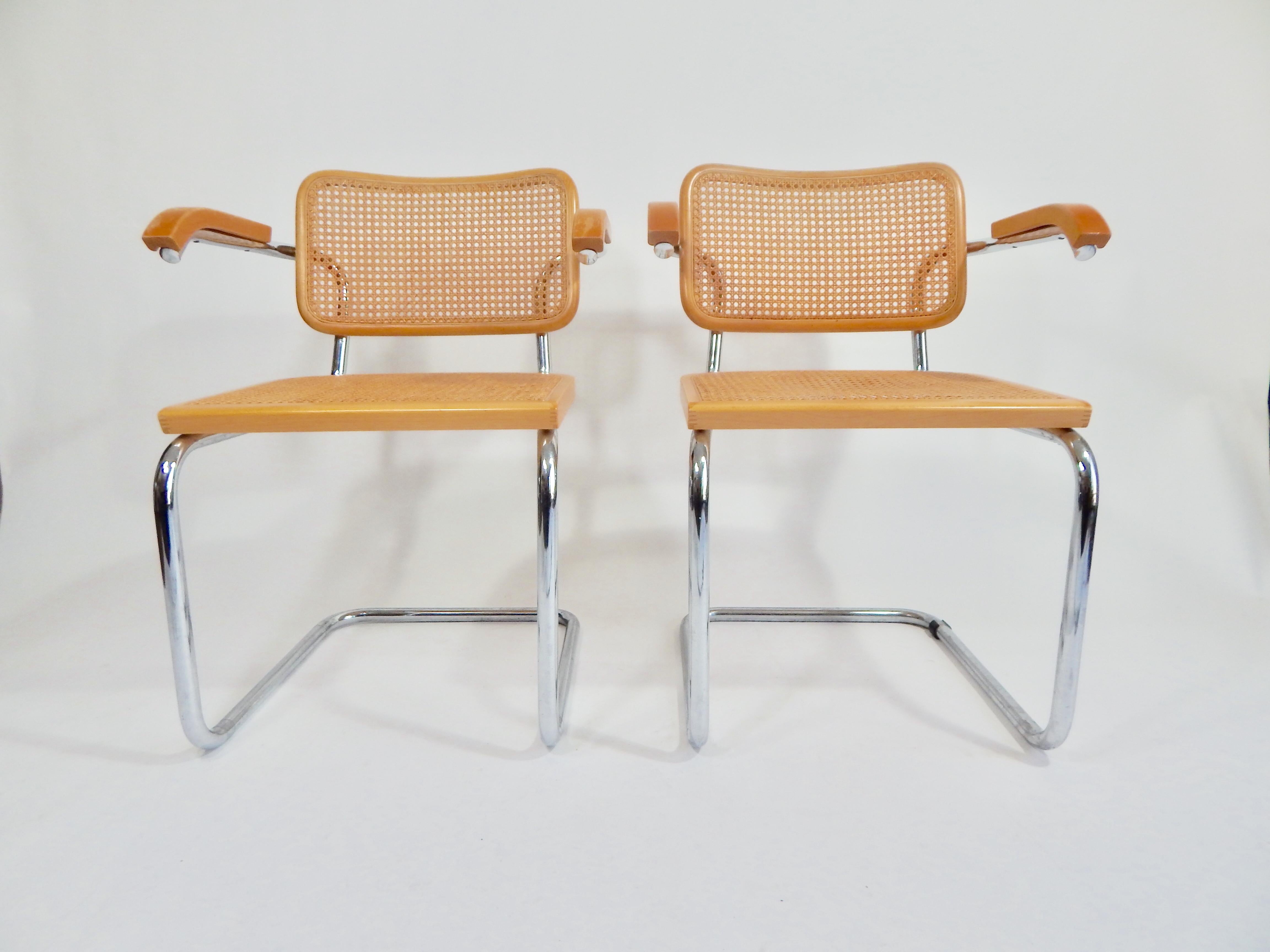 Pair  of midcentury Marcel Breuer Cesca armchairs in natural finish. Cane seats and backs. Classic chrome cantilever frames. We polish all chrome. 