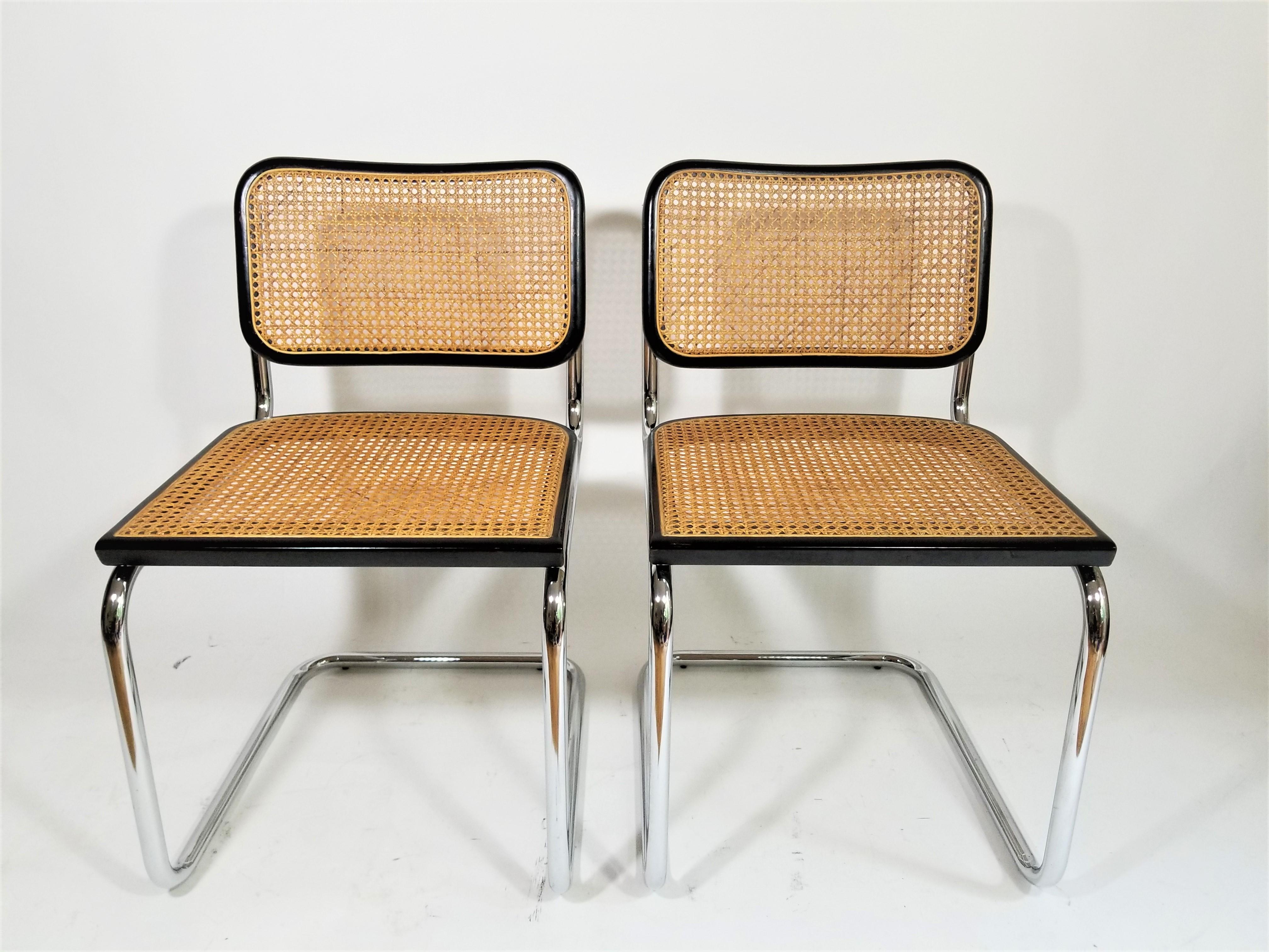 Pair of midcentury Marcel Breuer Cesca side chairs. Black finish. Cane backs and seats. Classic tubular cantilever chrome frame. We polish all chrome,
Made in Italy.
Measurements:
Height 32.5 inches
Seat height 18.5 inches
Width 18.5