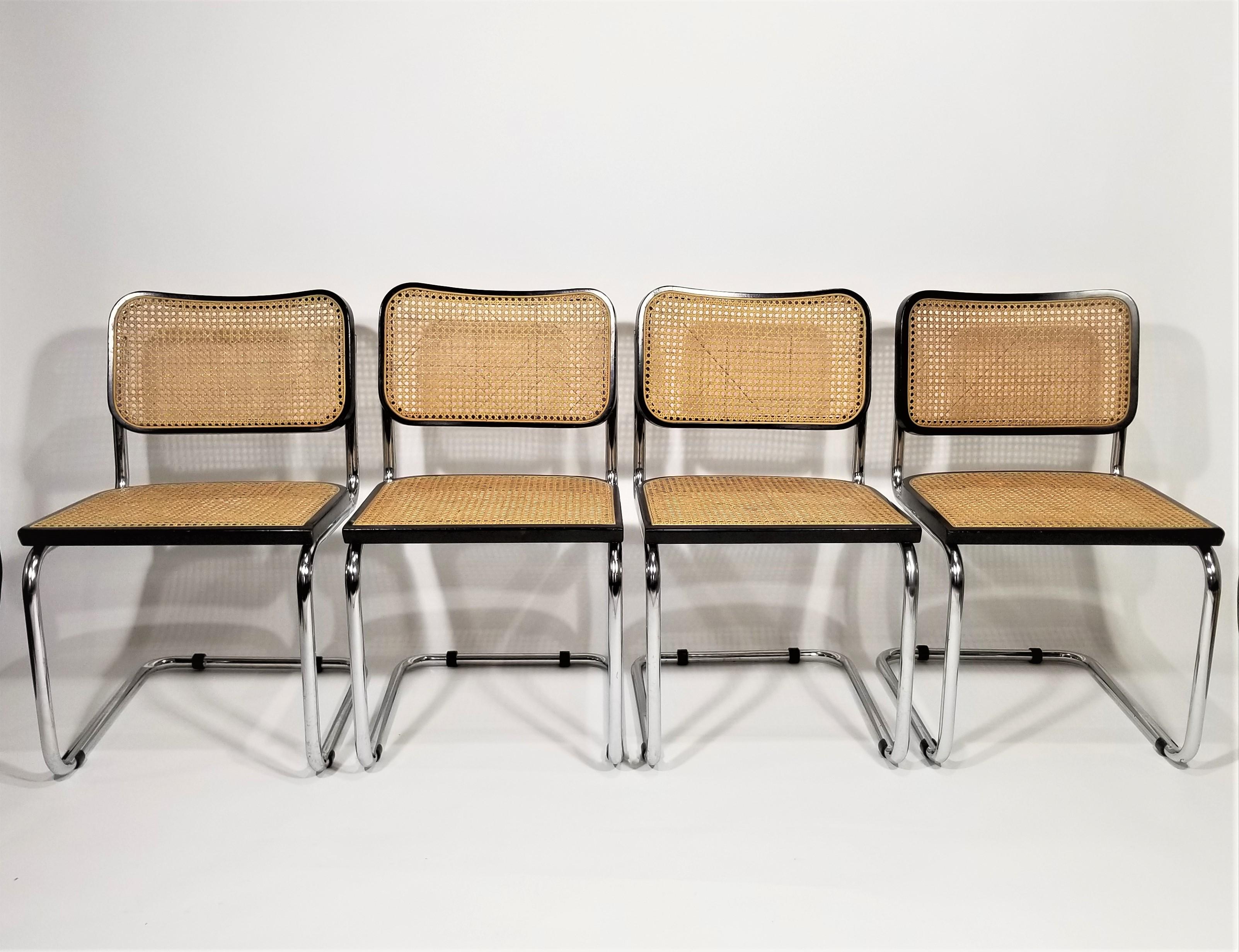 1960s Mid Century Black Marcel Breuer Cesca side chairs. Made in Italy. All parts are original. Cane seats and backs. Classic Chrome Cantilever frames. We polish all chrome. 

The chair on the far right has some very slight differences on close