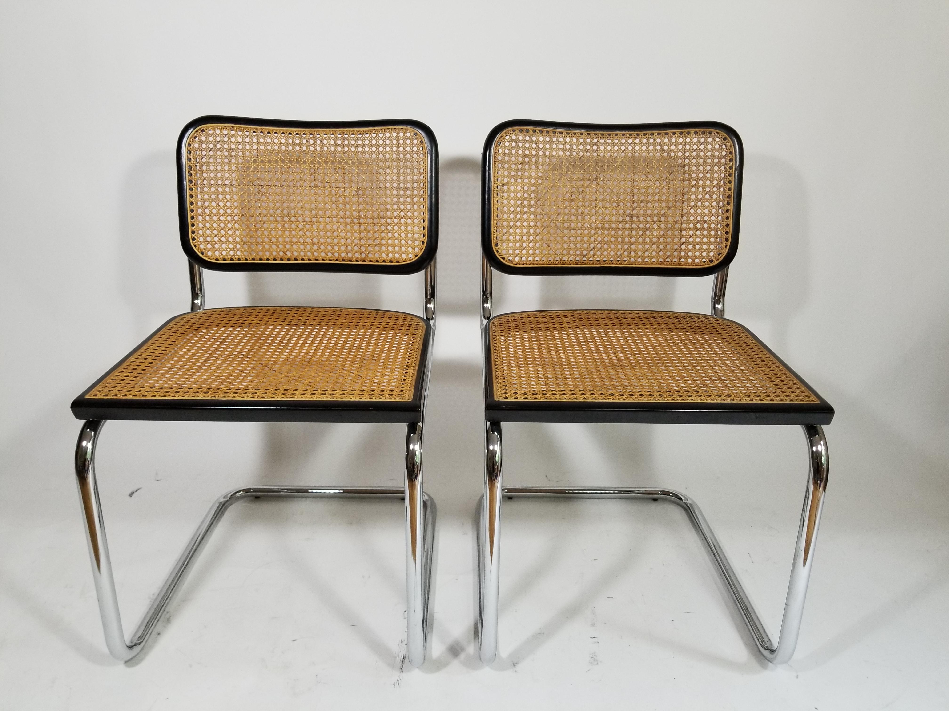 Midcentury pair of Marcel Breuer Cesca side chairs. Black finish. Cane back and seat. Caning is intact and is a gorgeous carmel color. Classic tubular chrome frame. Made in Italy.
Complimentary free delivery in NYC and surrounding areas can be