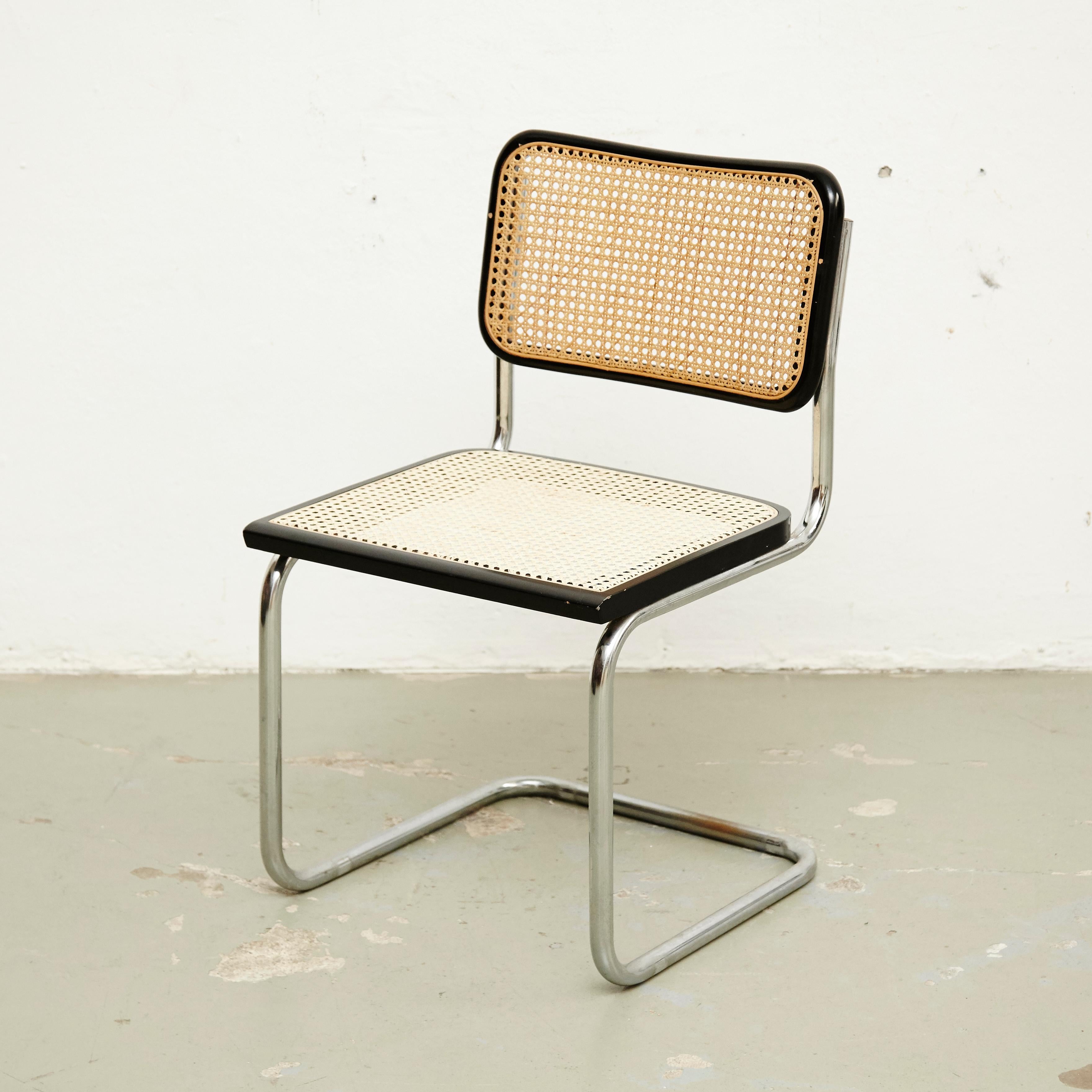 Chair, model Cesca, designed by Marcel Breuer around 1970, manufactured in Italy.
Metal pipe frame, wood seat and back structure and rattan.

 In good condition, with minor wear consistent with age and use, preserving a beautiful patina. The seat
