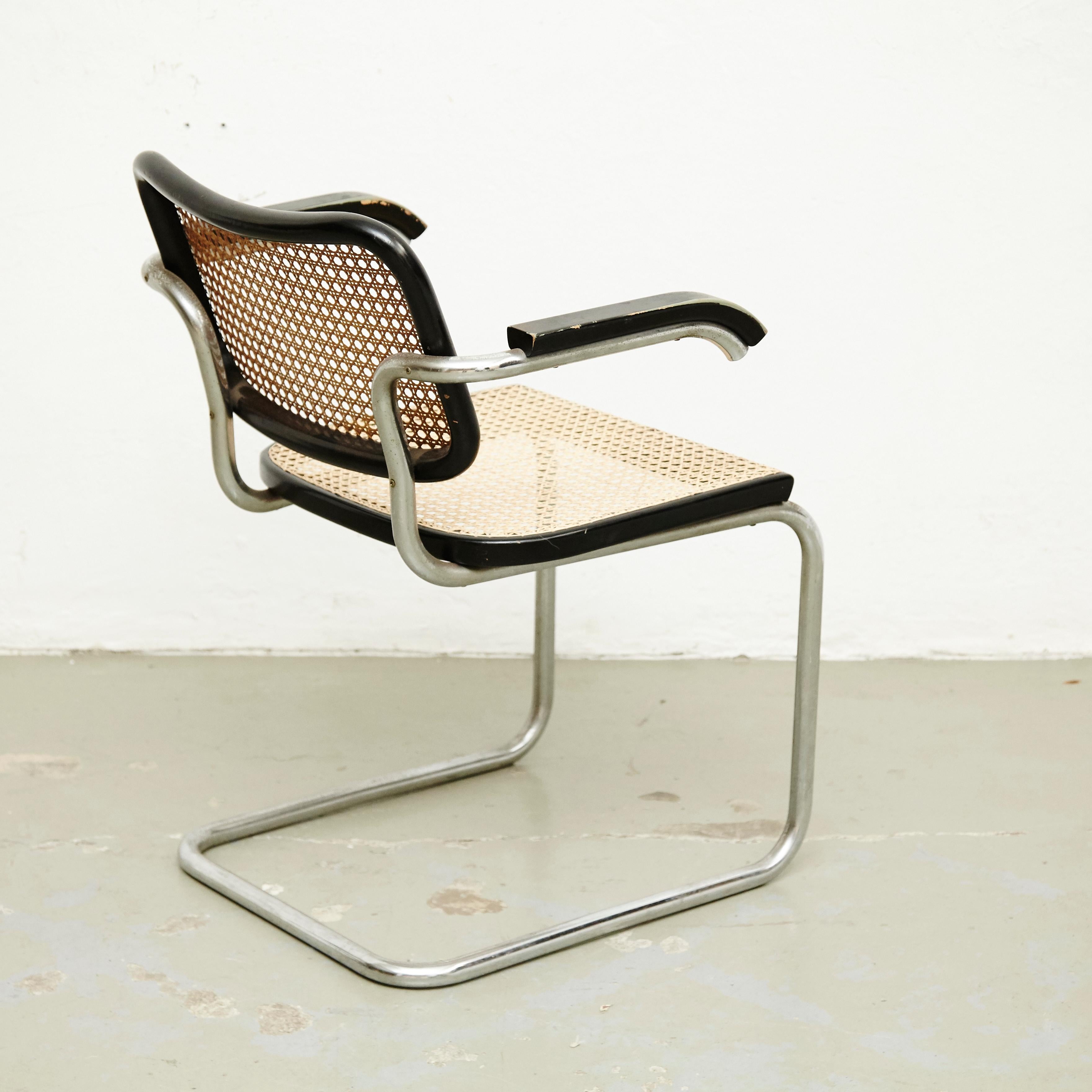 Chair, model Cesca, designed by Marcel Breuer circa 1970, manufactured by Gavina.
Metal pipe frame, wood seat and back structure and rattan.

In good condition, with minor wear consistent with age and use, preserving a beautiful patina. The seat