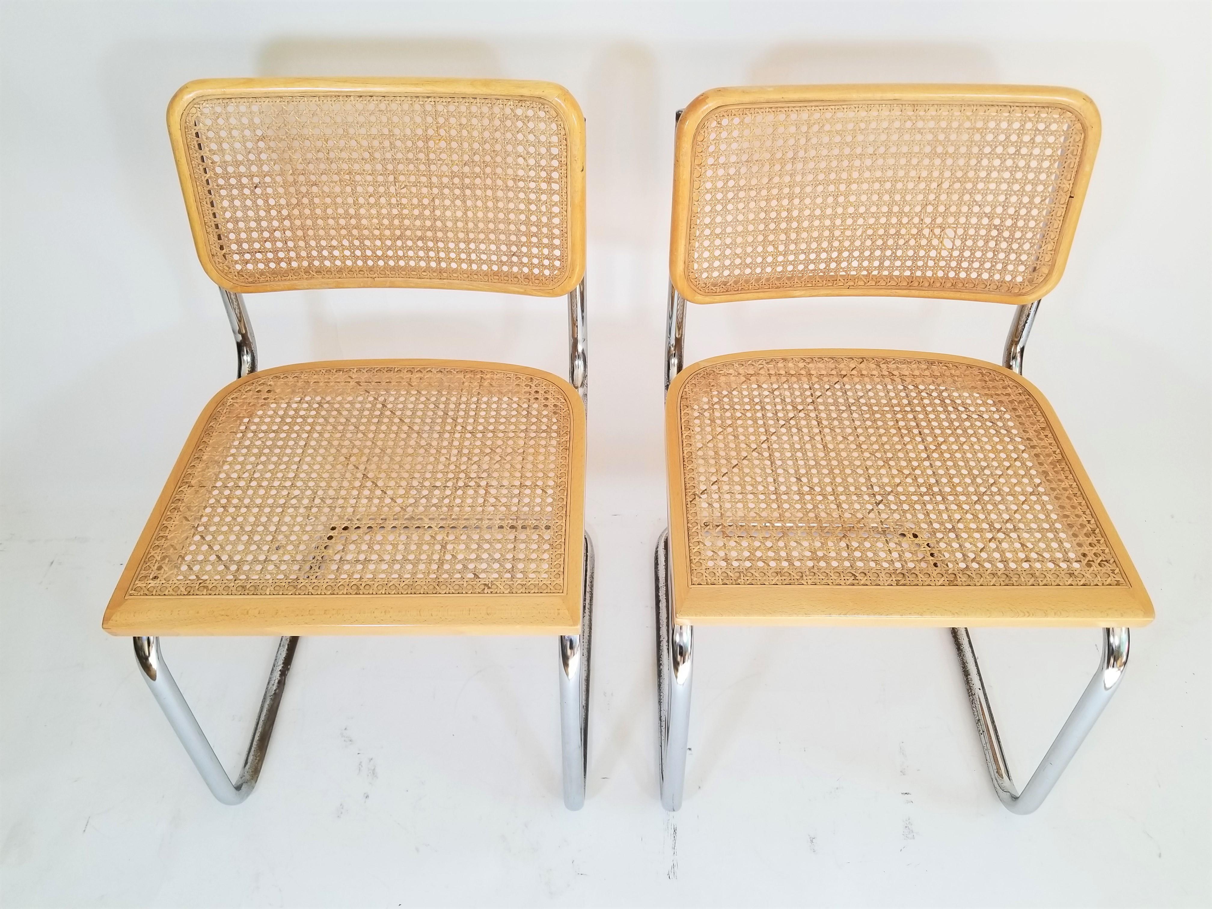 Mid century pair of Marcel Breuer Cesca chairs. Cane seats and backs. Natural finish. Classic chrome cantilever frames.