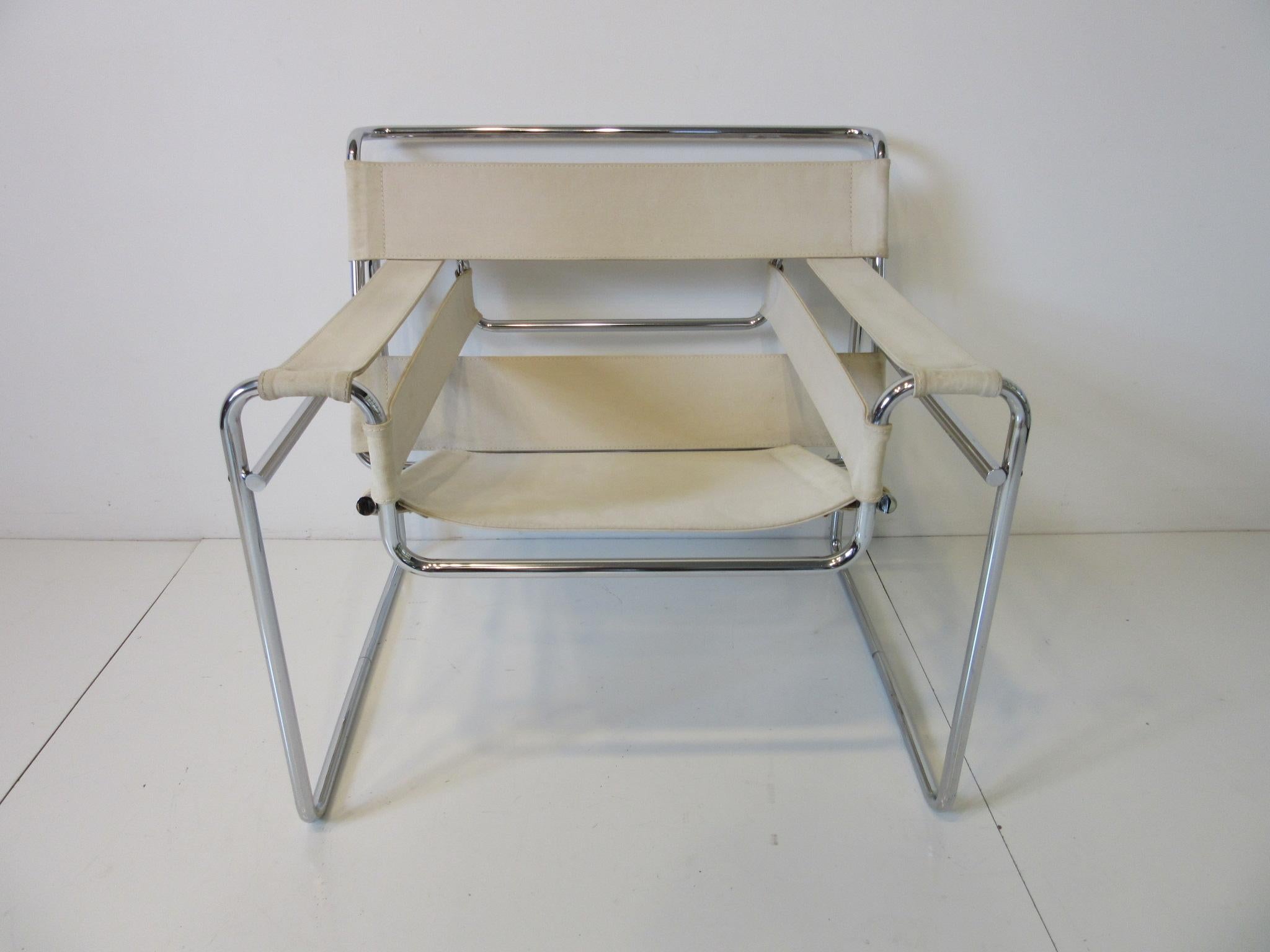 An early 1960s chromed seamless metal frame and heavy off white cream canvas Wassily chair, an International style icon manufactured by Knoll. This chair has the thick canvas seating and strapping canvas only in Knoll products.