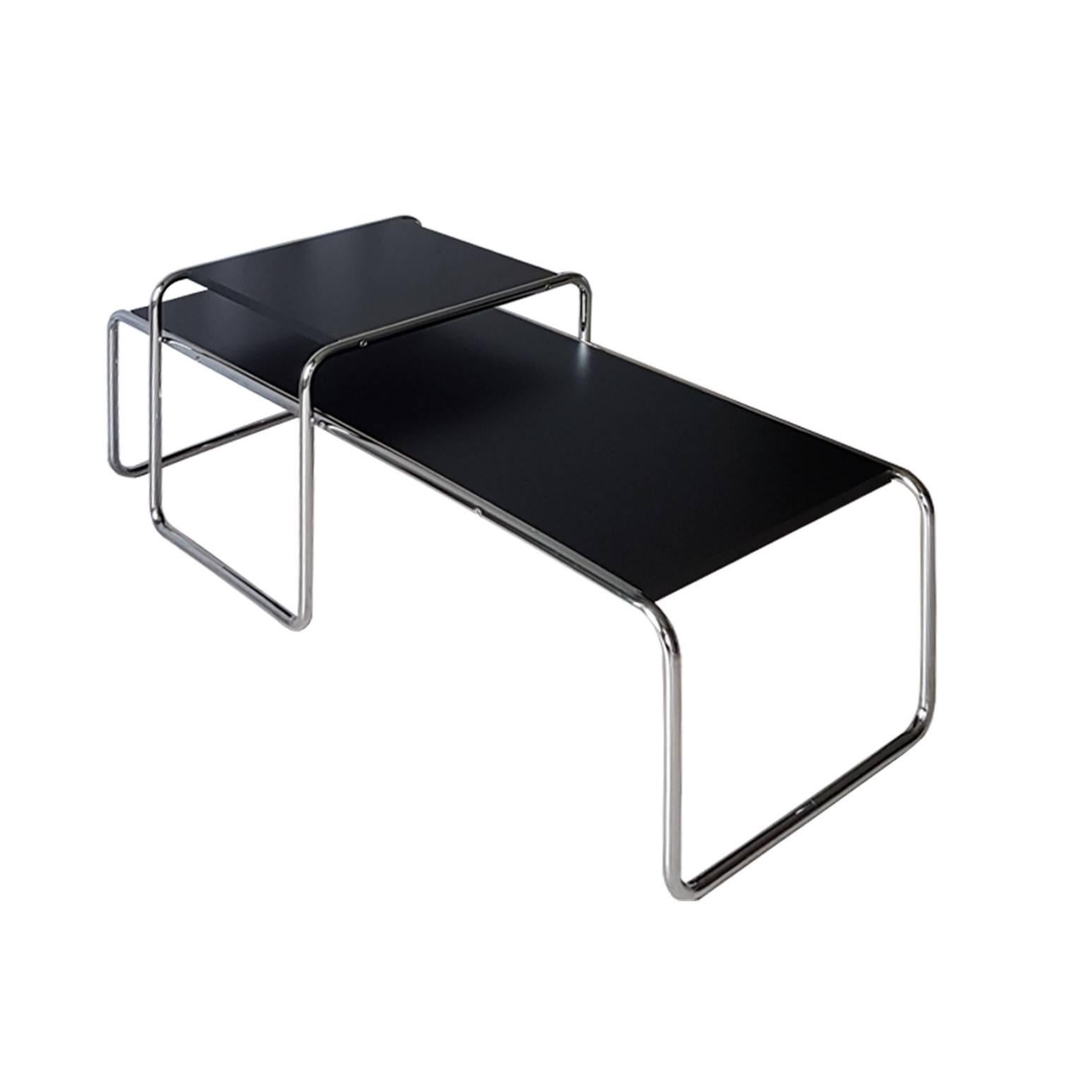 Set of coffee table in chrome-plated tubular steel with black plastic laminate top.
Design Drawing 1925 by Marcel Breurer.
The item comes from Alivar Museum Collection.
The concept of this Collection was developed from 1984 and it was based on a