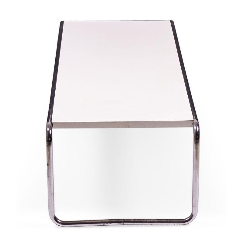 American International-Style (circa 1924) 'Laccio' coffee table with a white mica rectangular top supported on a chrome plated steel tube frame. (matching end/occasional table: DUF0019B) (MARCEL BREUER FOR GAVINA UNDER LICENSE FROM KNOLL