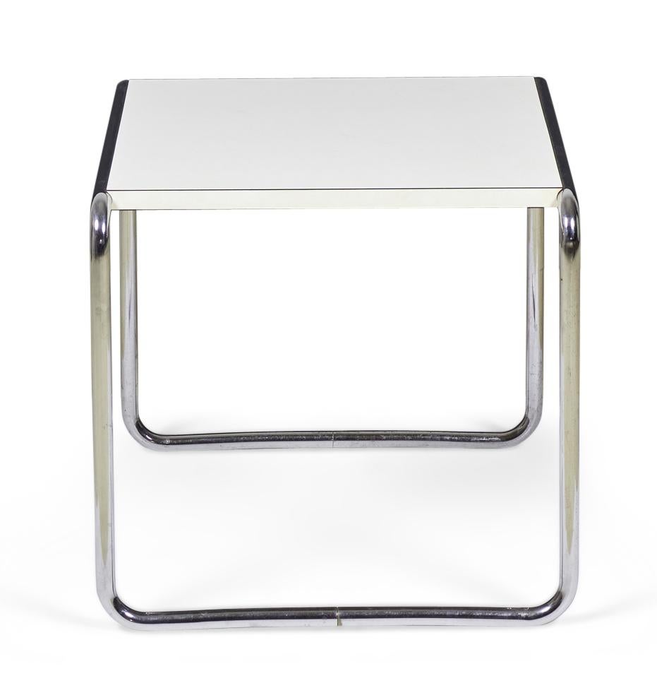 American International-Style (circa 1924) 'Laccio' end / occasional table with a white mica top supported on a chrome plated steel tube frame. (matching coffee table: DUF0019A) (MARCEL BREUER FOR GAVINA UNDER LICENSE FROM KNOLL INTERNATIONAL)

